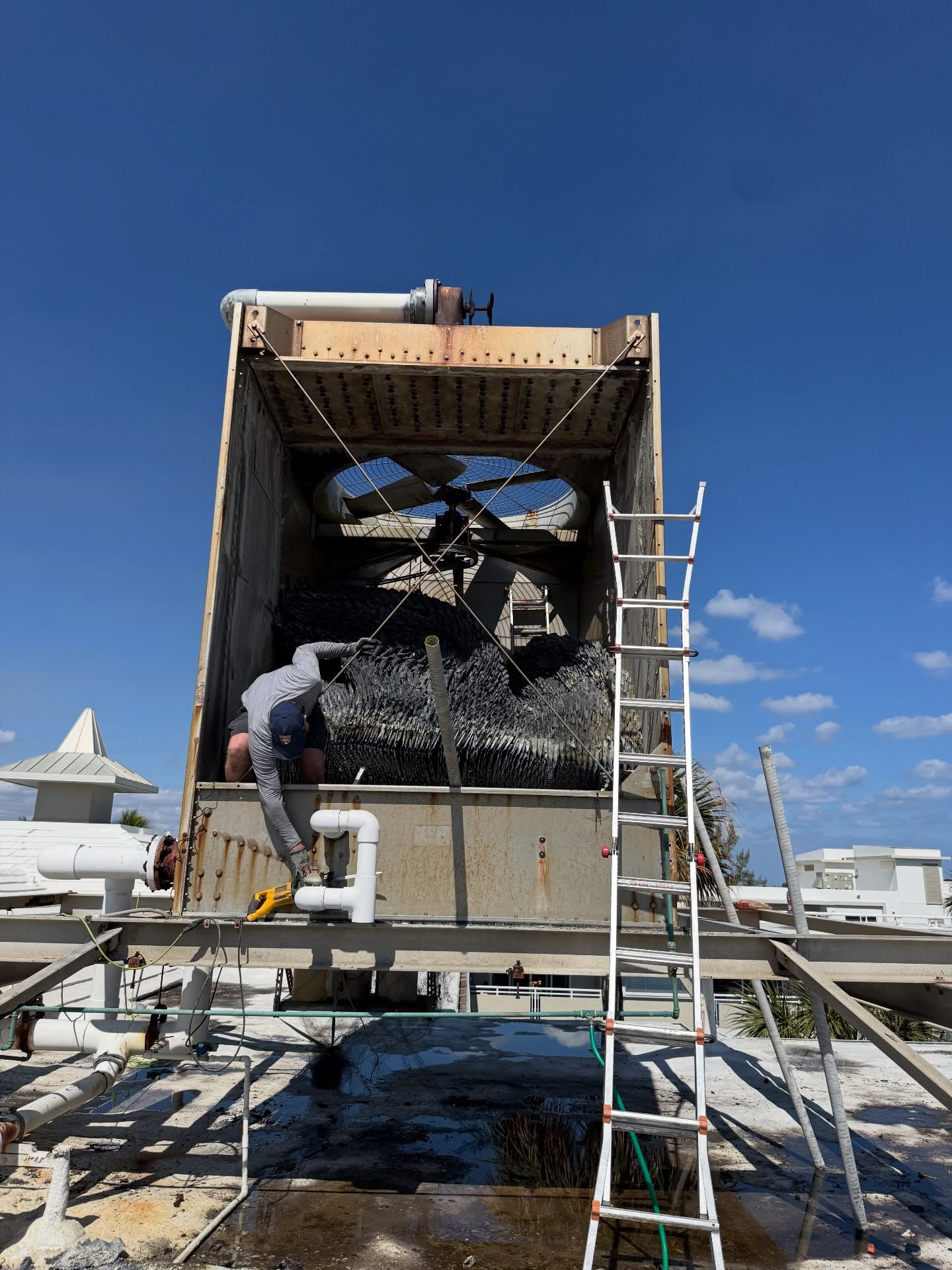 before and after of a fill replacement on an aging cooling tower