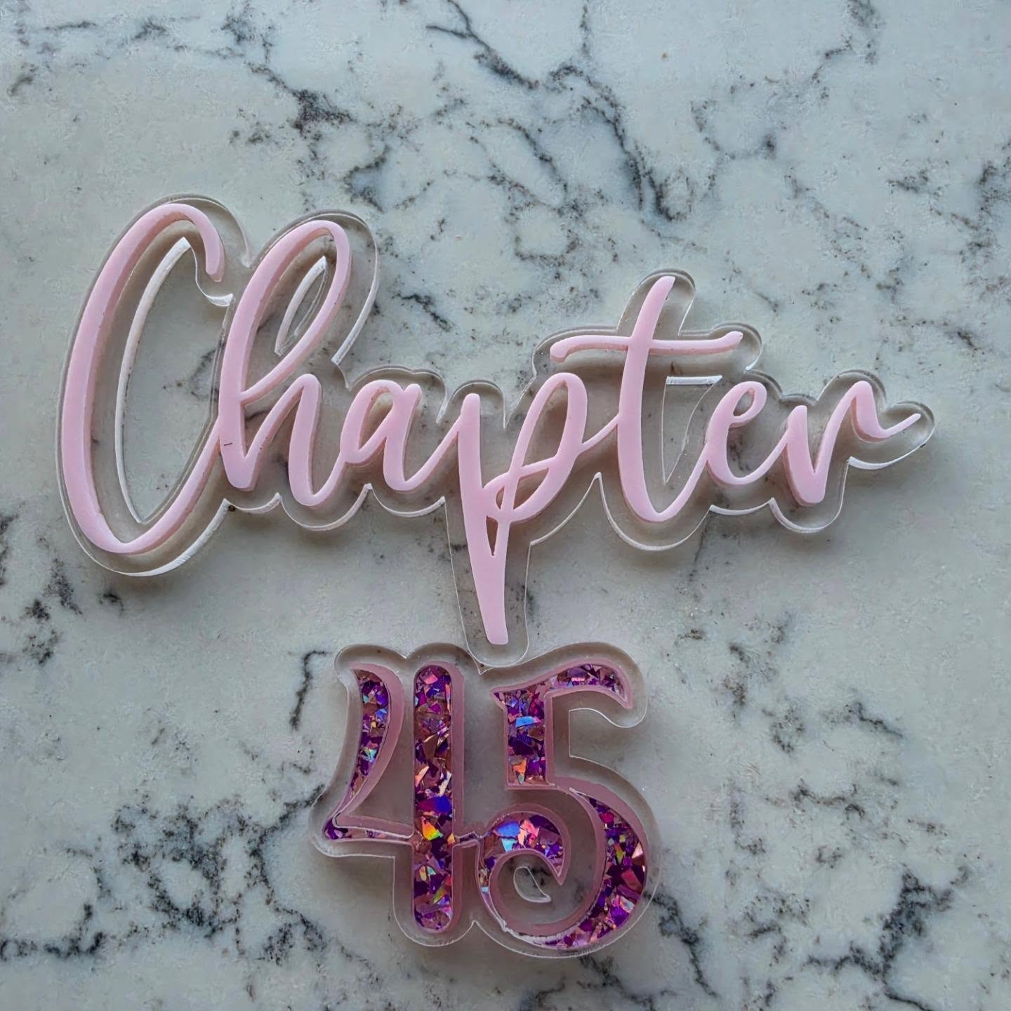 A little birthday project - pink, glitter and sparkles....just for me!
✨ Chapter 45 ✨
I wanted something a little different from a traditional cake topper, so I designed one that's reusable. Keep the Chapter and simply update the number each birthday 💝