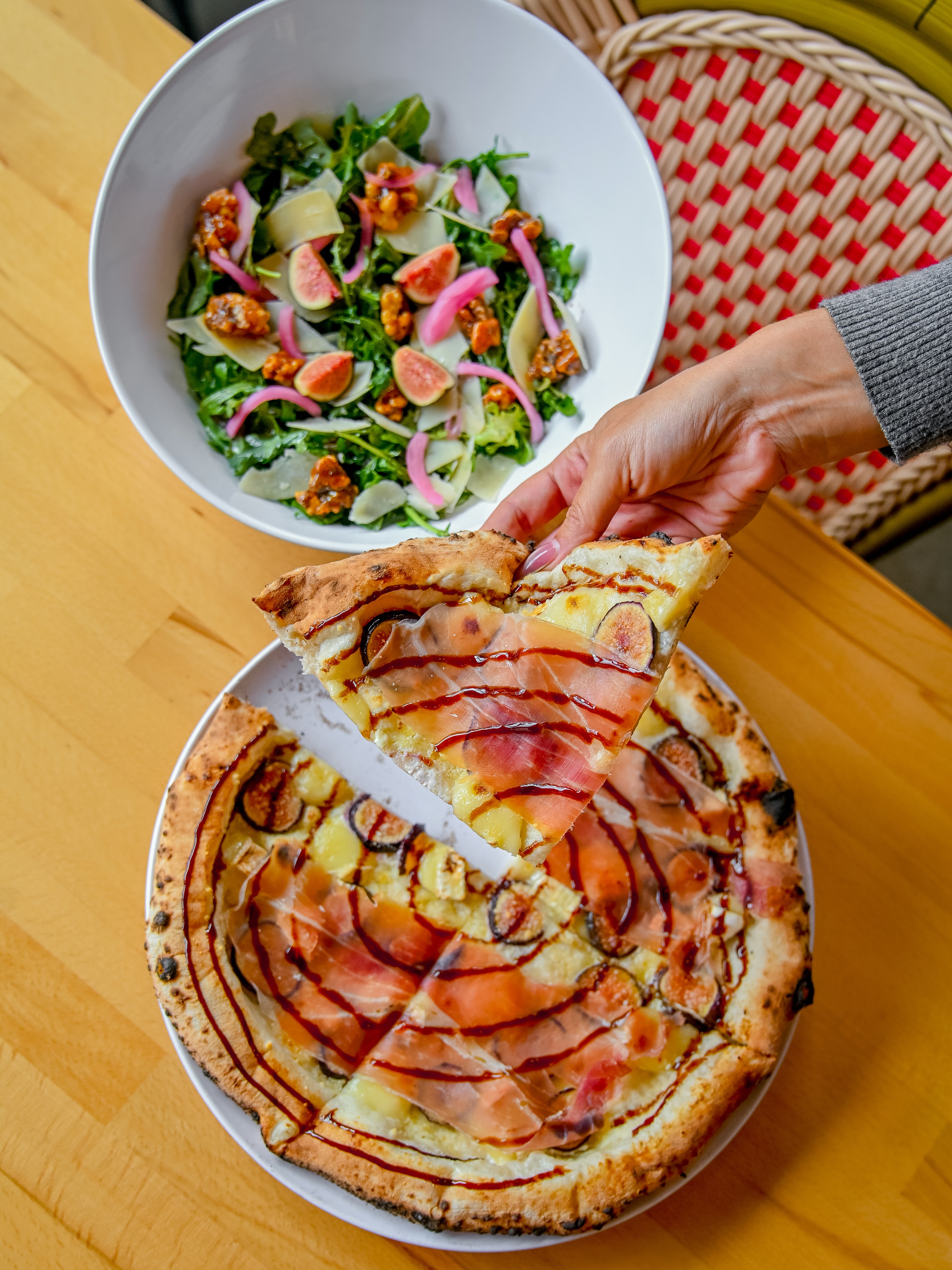 Thin, tender, and blistered in under 90 seconds at 900°F, that’s what a true Neapolitan crust gives you. No thick, doughy base competing for attention. Just enough char and chew to be the perfect stage for what’s on top.
Which matters when what’s on top is this good: fresh figs at peak season, creamy Brie, Prosciutto di Parma, and Italian cream sauce, finished with flaky sea salt.
Only here while we have the best seasonal figs!