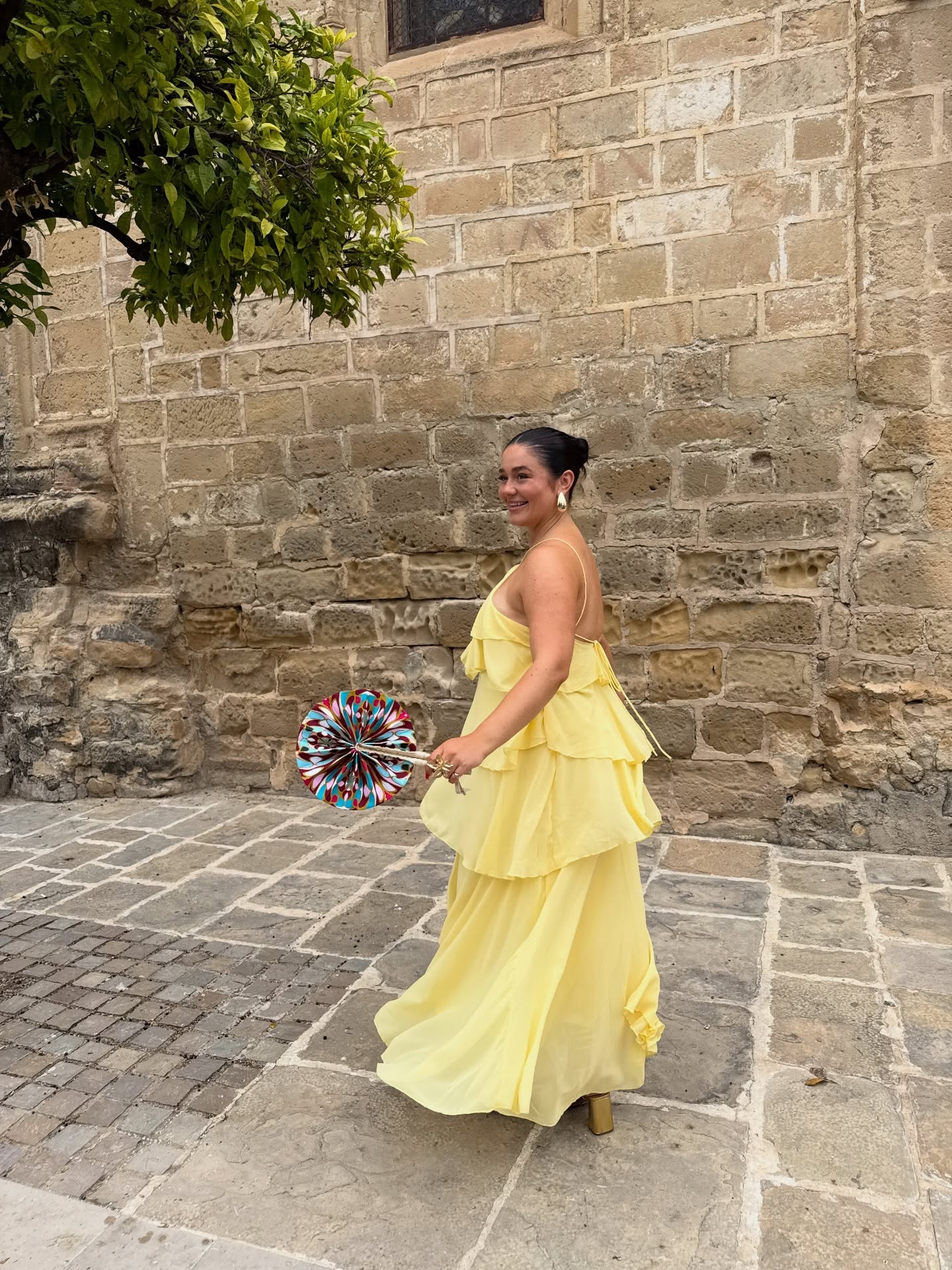 ✨ Warning: May cause spontaneous twirling. 💃
Our handcrafted fans aren’t just for keeping cool—they’re made for making an entrance. 🌴💛
.
@olivia_grier styling our pink jewel fan with her gorgeous yellow dress for the perfect wedding guest combo !
.
Where are you taking yours this summer?
.
#bijoucreates #summeraccessories #handfan