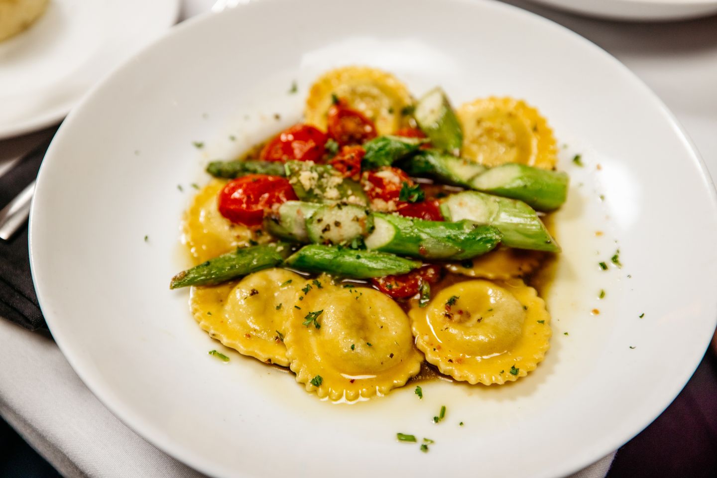Our Wild Mushroom Ravioli brings together savory mushroom-stuffed pillows, fresh asparagus, ripe tomatoes, and a rich basil garlic butter sauce for a meal that's satisfying from the first bite to the last.