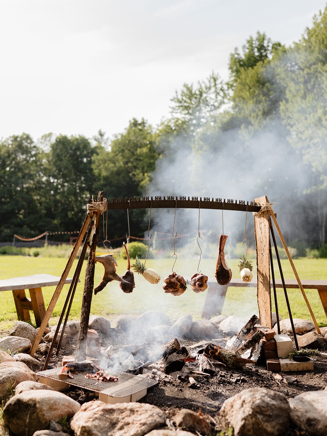 Last week we were blessed with a visit from our New Orleans friends @openfireco . And what better way to get together than with a signature Lil Hang right here at @caswellfarmmaine!
•
It was a fun day of Fire, Friends and Collaboration in our idyllic little piece of the Maine woods. @alittlesomethingcaswell provided the veggies and set the backdrop, @harborfishmarket, @dameriacres and @labellepatrimoine provided the meats and fishes, @kimchibeyondcompare let us use some of her amazing product, and handful of friends and neighbors set the table.
•
All photos by the inimitable @jesskearney_ (thank you, Jess!)
•
Menu:
-Bluefin Collar/Fire Bread/Kimchi
-@bangsislandmussels / @the_beststopcarencro boudin
-Beef Heart Anticuchos
-Miso Snap Peas + Hakurei Turnips
-Rosemary Basted D’Ameri Acres Tomahawks
-Smoked @labellepatrimoine Chicken
-Grilled Carrots with Zata’ar Yogurt
-Potato Gnocchi with Sage Butter
-Smoked Pineapple