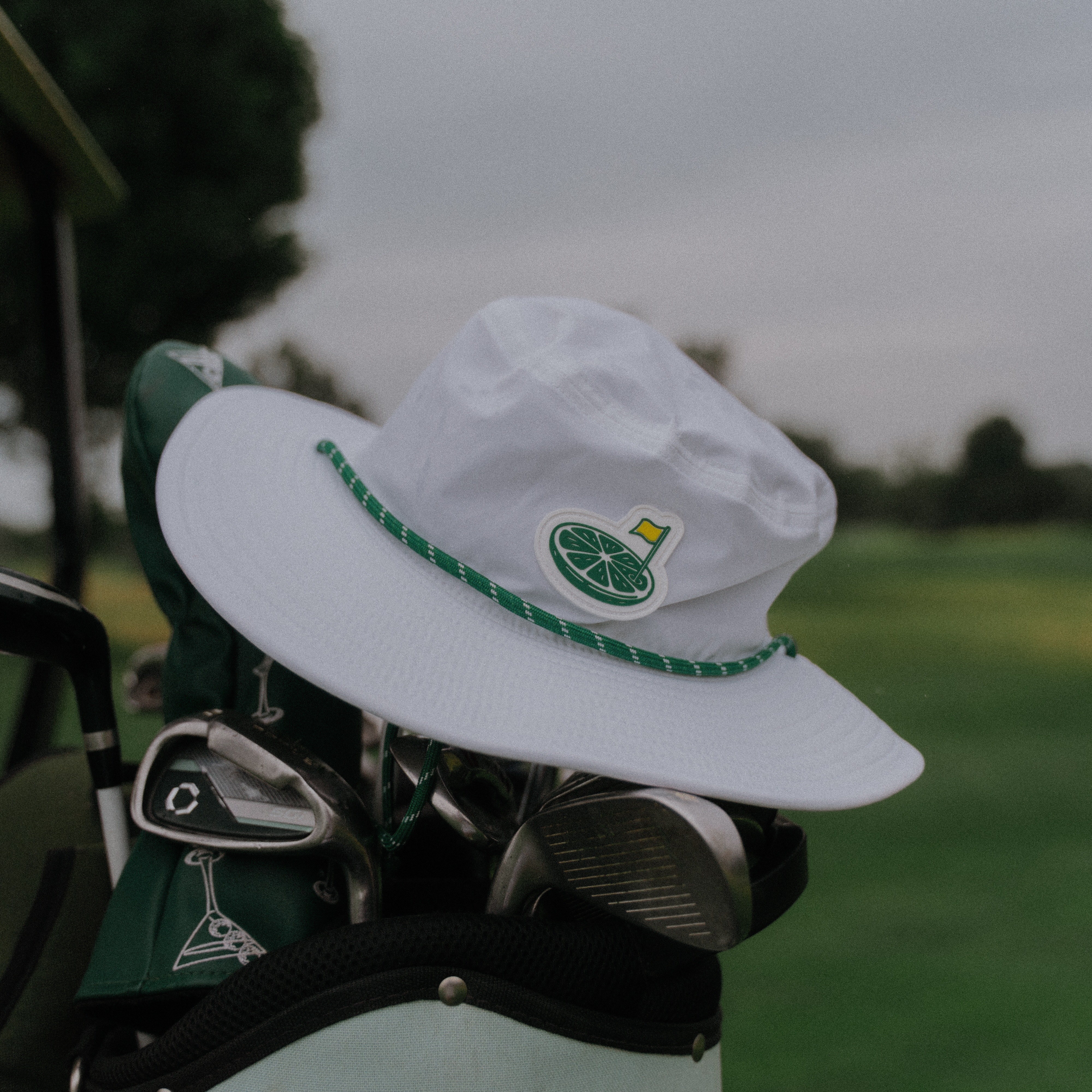 The Back Nine Bucket Hat.
Wide brim. Adjustable chin cord. Subtle HB embroidery on the side.
This hats made for sunny rounds, clubhouse drinks, lake days, and anywhere else your game, or weekend, takes you.