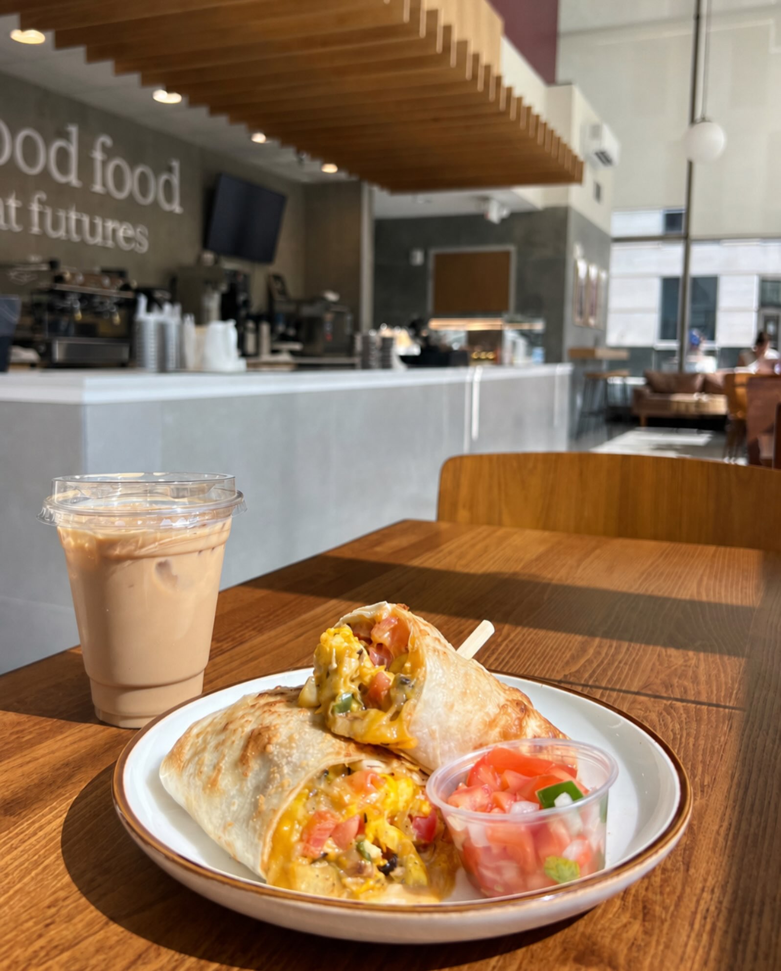 Come in & try our delicious breakfast burrito!
Sautéed green pepper, onion, and potatoes, scrambled eggs, and melty cheese, all wrapped up and topped with fresh pico de gallo. Paired with our iced latte for the full morning reset.
Come start your morning off right with us!