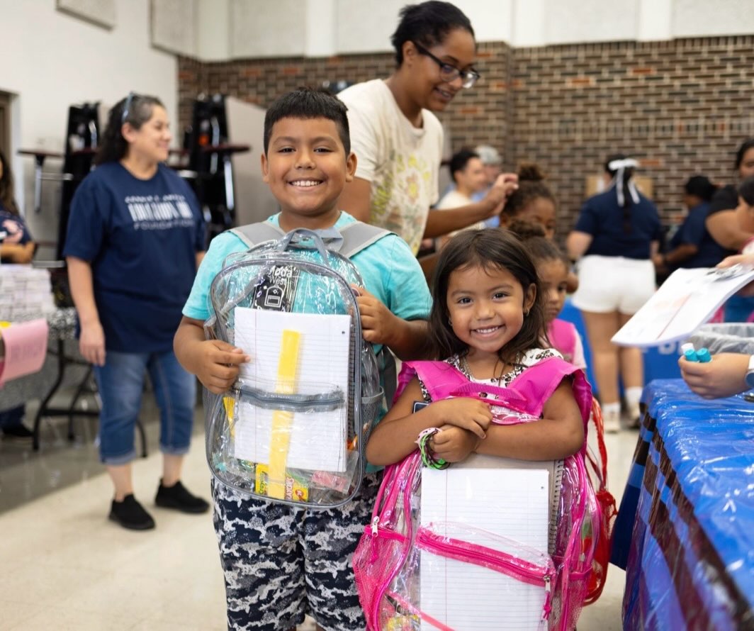 A retired school registrar and secretary in the Lockhart ISD keeps getting children ready for school with brand new backpacks and smiles on their faces!
Connie S. Amaya gave away nearly 1,000 new backpacks to Lockhart students this summer, and in the past eight years, her @csaeducationaid has funded almost 4,000 backpacks! The group gave away all sorts of other school supplies as well.
Amaya realized the need of district students who are economically disadvantaged, so when she retired, she began supporting families by giving away backpacks with her own retirement money. Volunteers and donors keep her goodwill efforts going.
This year’s event was extra meaningful, because it was the first backpack giveaway held at Pride High School since she retired five years ago. #backtoschool #giveback #lockhartisd #backpacks #backpacksforkids