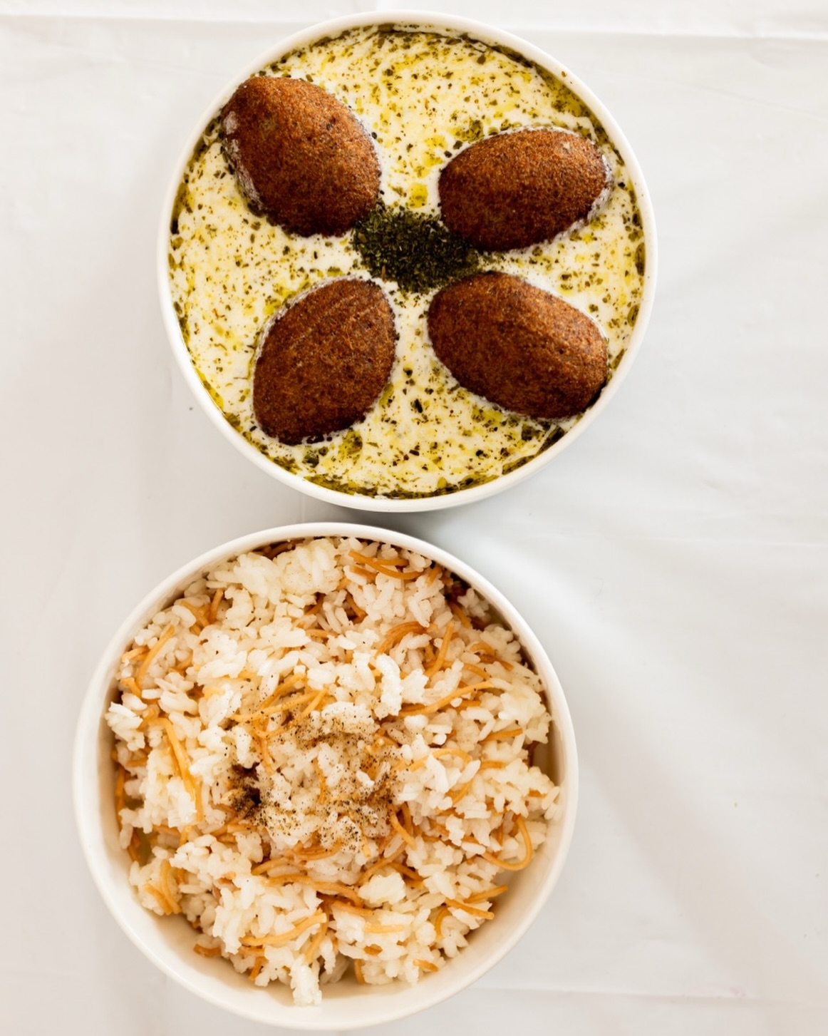 Kibbeh Labanieh 🤍✨
A true taste of the Levant. Crispy golden kibbeh served in rich, creamy yoghurt, perfectly paired with fragrant vermicelli rice for a comforting meal full of authentic flavour.
📍 Available now at Shamiat Restaurant.
#ShamiatRestaurant #KibbehLabanieh #MiddleEasternFood #AuthenticCuisine #arabicfood