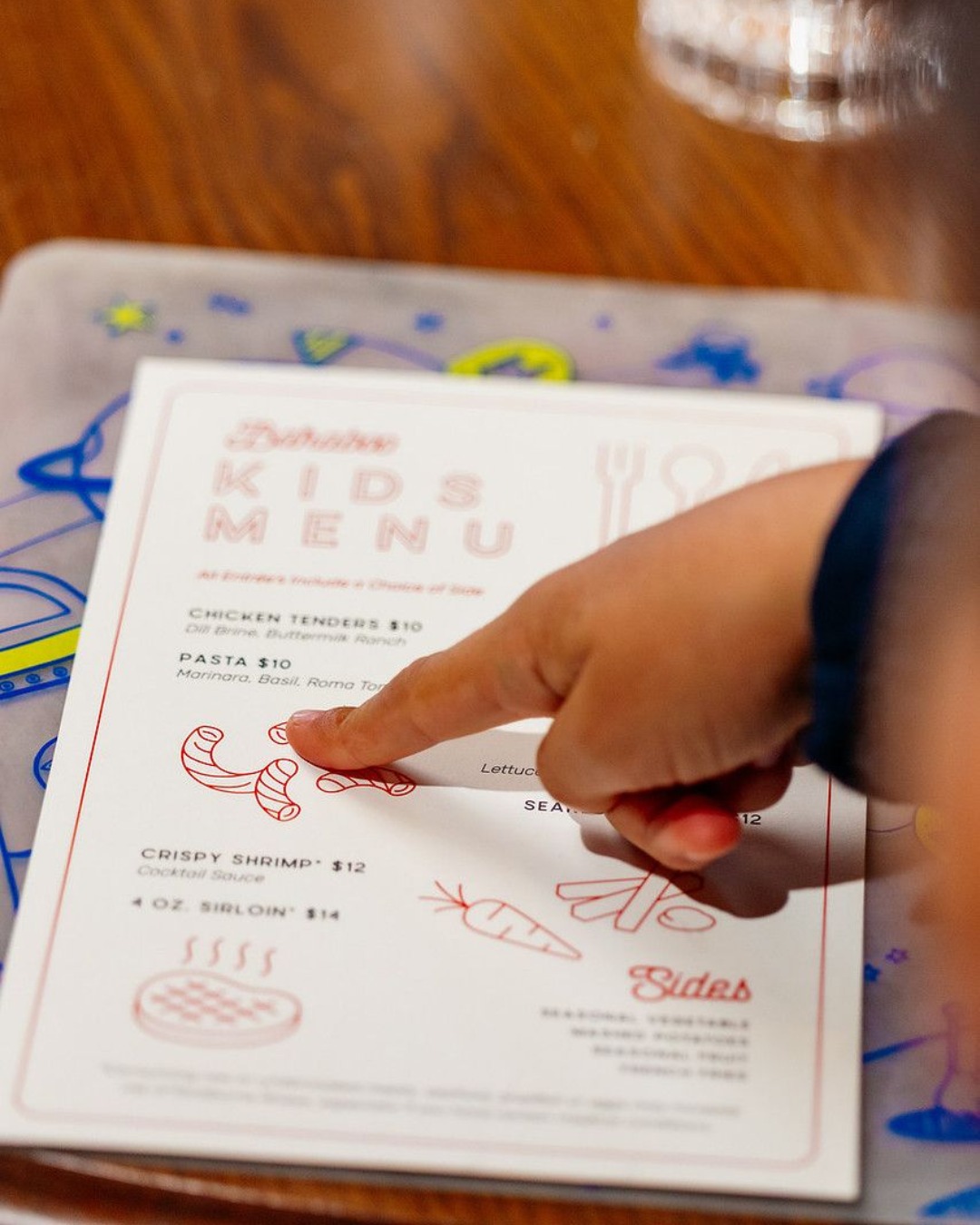 While the grown-ups enjoy Old Fashioneds and supper club classics, we've got the little ones covered too. A kids menu, coloring activities, and a table where every generation feels at home.
