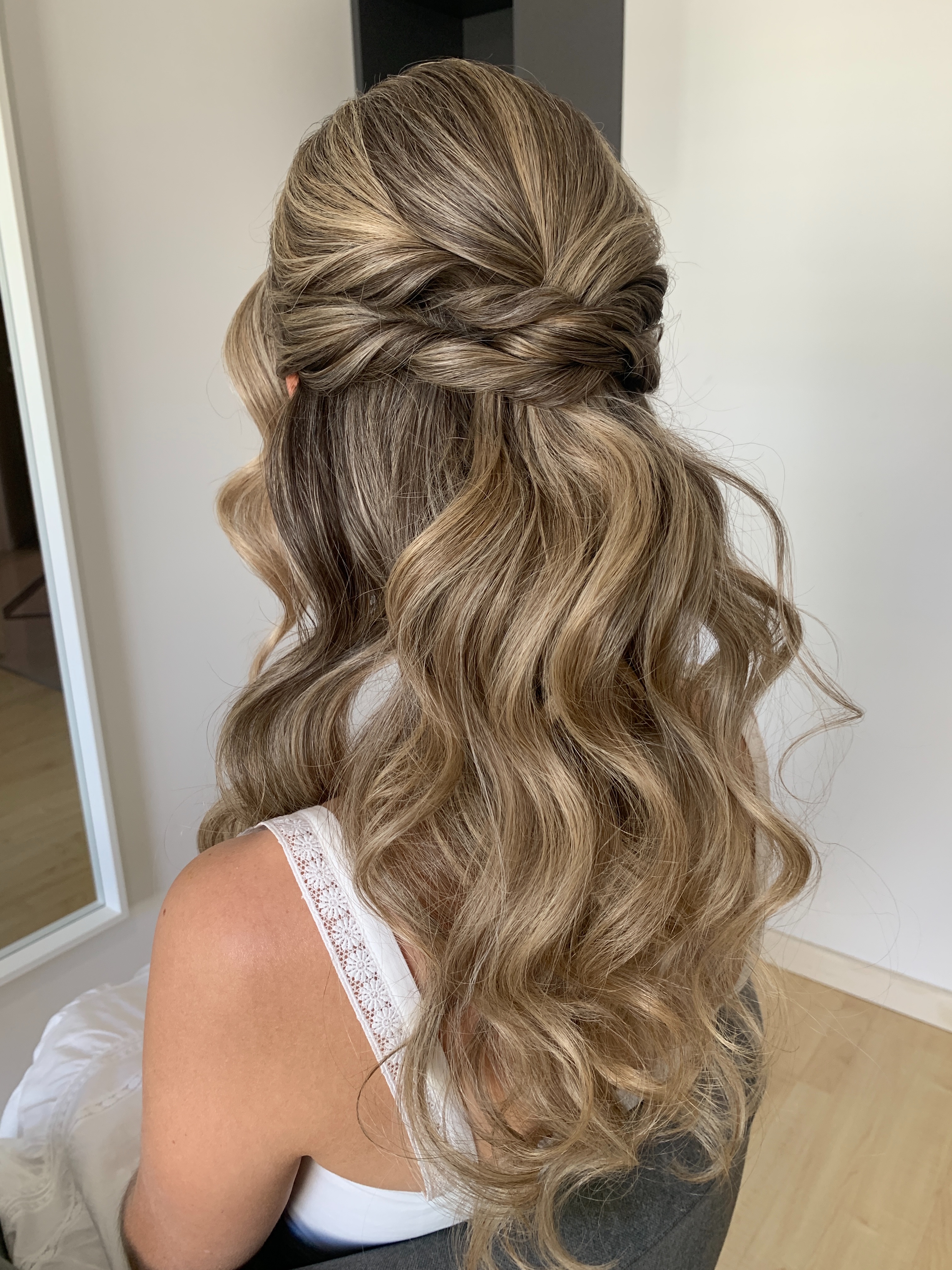 Sophie came to her trial loving the idea of a half-up half-down style (because let’s be honest… the back detail is EVERYTHING ✨), but there was one little thing she wasn’t sure about…
She usually wears her hair down and tucked behind one ear, and she was worried that wearing her hair the way she normally does wouldn’t feel “bridal” enough for her wedding day.
So we played! 🤍
At her trial, we tried a few different options for her:
✨ Half-up half-down with face framing
✨ One side swept back to create a tucked-behind-the-ear look
✨ Her hair completely down, but elevated into a bridal version of her everyday style
For Sophie, we added a little extra volume through her fringe, volume through the crown, and soft waves to take her everyday look and turn it into a bridal version.
On the wedding day, Sophie chose soft waves with one side tucked behind her ear- the style that made her feel the most like herself, while still feeling special for her wedding day. 🤍
And the half-up half-down style we trialled? Her bridesmaids ended up wearing that version instead! ✨
This is exactly why trials are so valuable- they’re not about locking you into one idea. They’re about finding the style that makes you feel the most confident walking down the aisle.