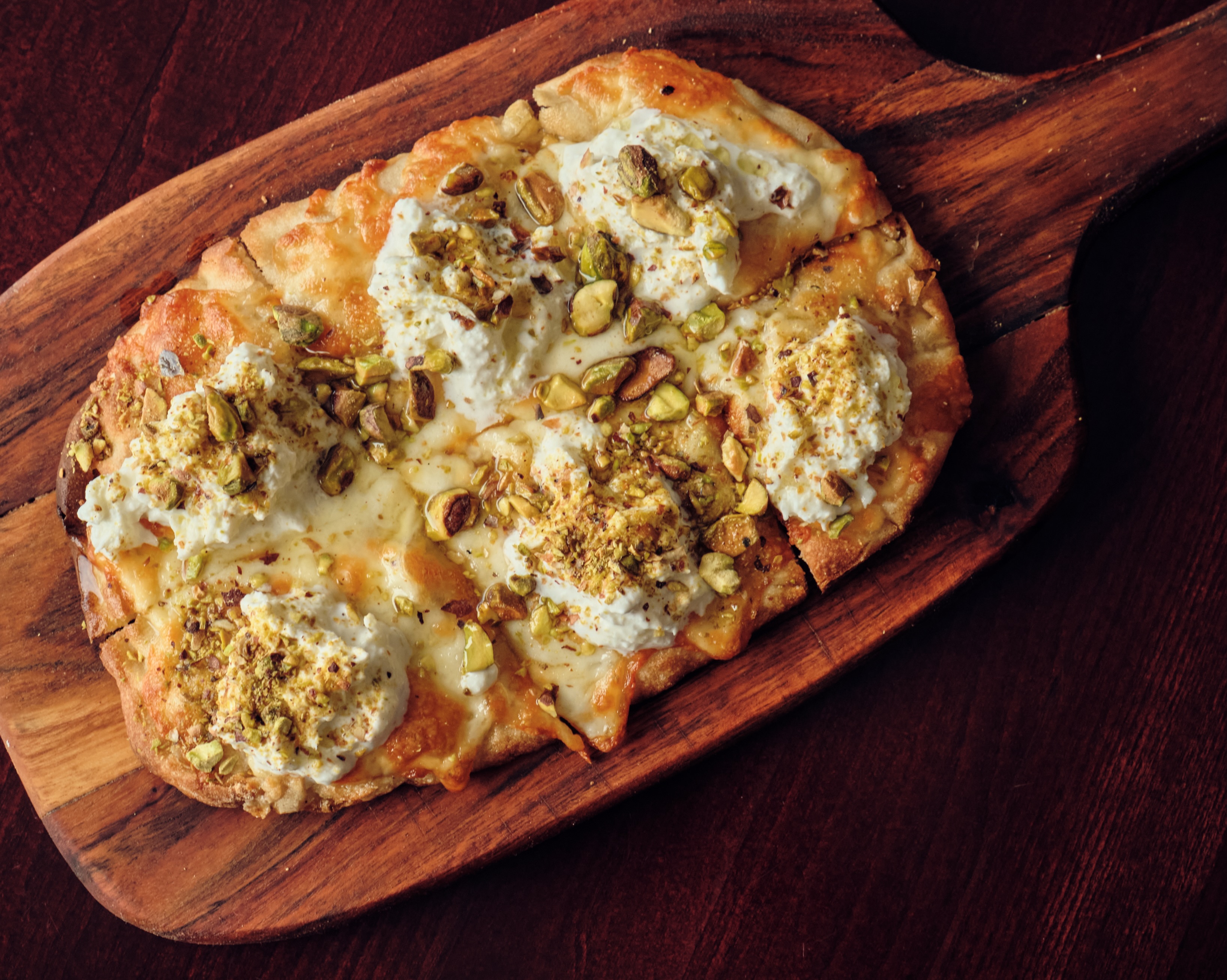 BIANCA PINSA ROMANA 🤍
Crisp. Light. Authentically Roman.
Our Bianca Pinsa Romana is topped with creamy stracciatella burrata, roasted pistachios, and a delicate drizzle of premium extra virgin olive oil, creating the perfect balance of rich flavors and airy texture.
A timeless Italian classic, elevated with every bite.