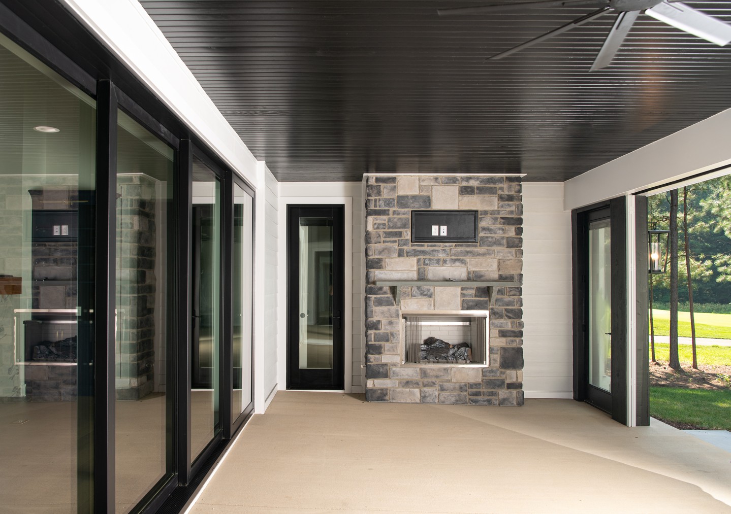 A well-designed home creates a connection—not a boundary.
With oversized sliding doors, a stunning stone fireplace, and a covered porch built for every season, this space was thoughtfully designed to make outdoor living just as important as what's inside. It's where architecture meets lifestyle, creating one seamless experience from room to room.
That's the beauty of intentional design.