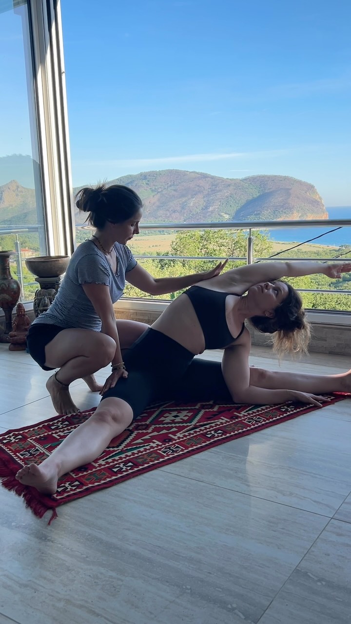 Touch is a language all on its own. 🤍
If you’ve taken class with me before, you know that hands-on assists are a big part of my teaching style.
Sometimes it’s the lightest touch on your shoulders to remind you to let them melt away from your ears.
Sometimes it’s a gentle grounding hand on your low back in Child’s that helps you soften, unclench, and surrender a little more deeply into gravity.
Sometimes it’s a yummy essentials oil Savasana massage.
To me, hands-on assists have never been about pushing someone deeper into a pose. They’re about helping you feel more connected to your own body and supported.
And there’s actually science behind why touch can be so powerful….
When offered with consent, intention, and skill, supportive touch can:
✨ Help the nervous system shift toward a more relaxed, parasympathetic state.
✨ Increase body awareness (proprioception), helping you better understand where you are in space.
✨ Encourage muscles to soften instead of gripping or bracing.
✨ Create a sense of grounding, safety, and connection.
As yoga teachers, we often talk about “letting go,” but sometimes our bodies need a little support before they feel safe enough to do that.
I think that’s the real magic of a thoughtful hands-on assist. Sometimes the most powerful adjustment isn’t changing your posture...It’s reminding your nervous system that it is safe enough to let go. 🤍
As always, every hands-on assist I offer is consent-based, individualized, and completely optional.
And if you LOVE Hands-On Assists… consider joining @tararose.niv and I September 13 @ebbandflostudio
.
.
.
.
.
This lovely moment was from our Montenegro retreat @mahakala.center with the lovely @candice.ferreira
.
.
.
.
.
.
#yoga #yogaassist #massage #torontoyoga #yogatoronto