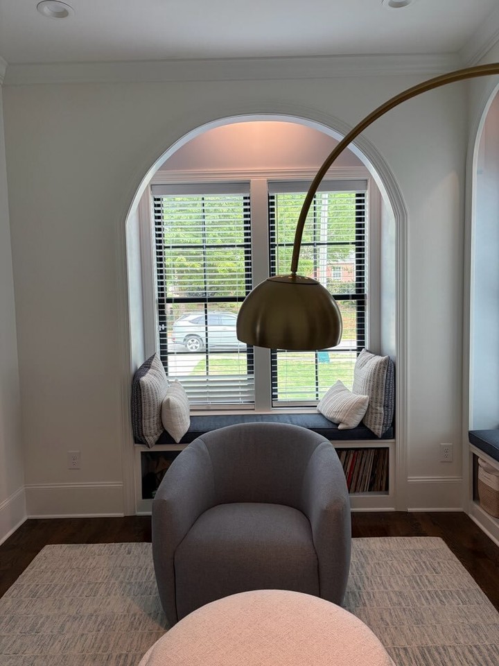 A little reading nook moment deserves its own post. ✨
This custom library in Raleigh was designed by the homeowner, who happens to be an architect, and we had the fun job of bringing the details to life. The arched built-ins, window bench, soft lighting, and subtle blue interior paint all came together to make this room feel calm, collected, and completely custom.
Details we love:
✨Arched trim details
✨Built-in window bench
✨Benjamin Moore Silvermist interiors
✨Sherwin-Williams Snowbound faces + walls
✨Custom bookshelves surrounding the room
Sometimes the best seat in the house is tucked right into the cabinetry.