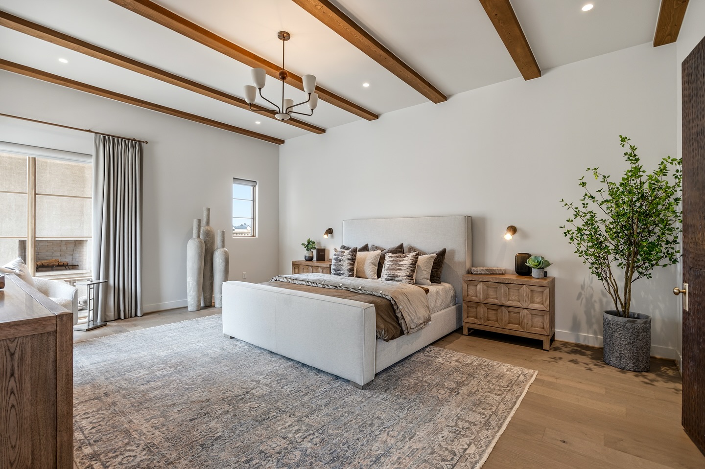 The primary suite was designed as a private retreat within the home. A corner sitting area surrounded by windows captures views of the backyard, creating a quiet place to pause and enjoy the landscape. A private transition from the suite extends outdoors to a fireplace, allowing the experience of the home to continue beyond the walls.
The primary bathroom carries that same feeling of serenity. Clean lines, warm polished tile, marble accents, and thoughtful material selections create a spa-inspired atmosphere.
www.pddtexas.com
Builder: @derekcooperconstruction
Subdivision: @redfeathergc
Media: @ashleyadamsmedia