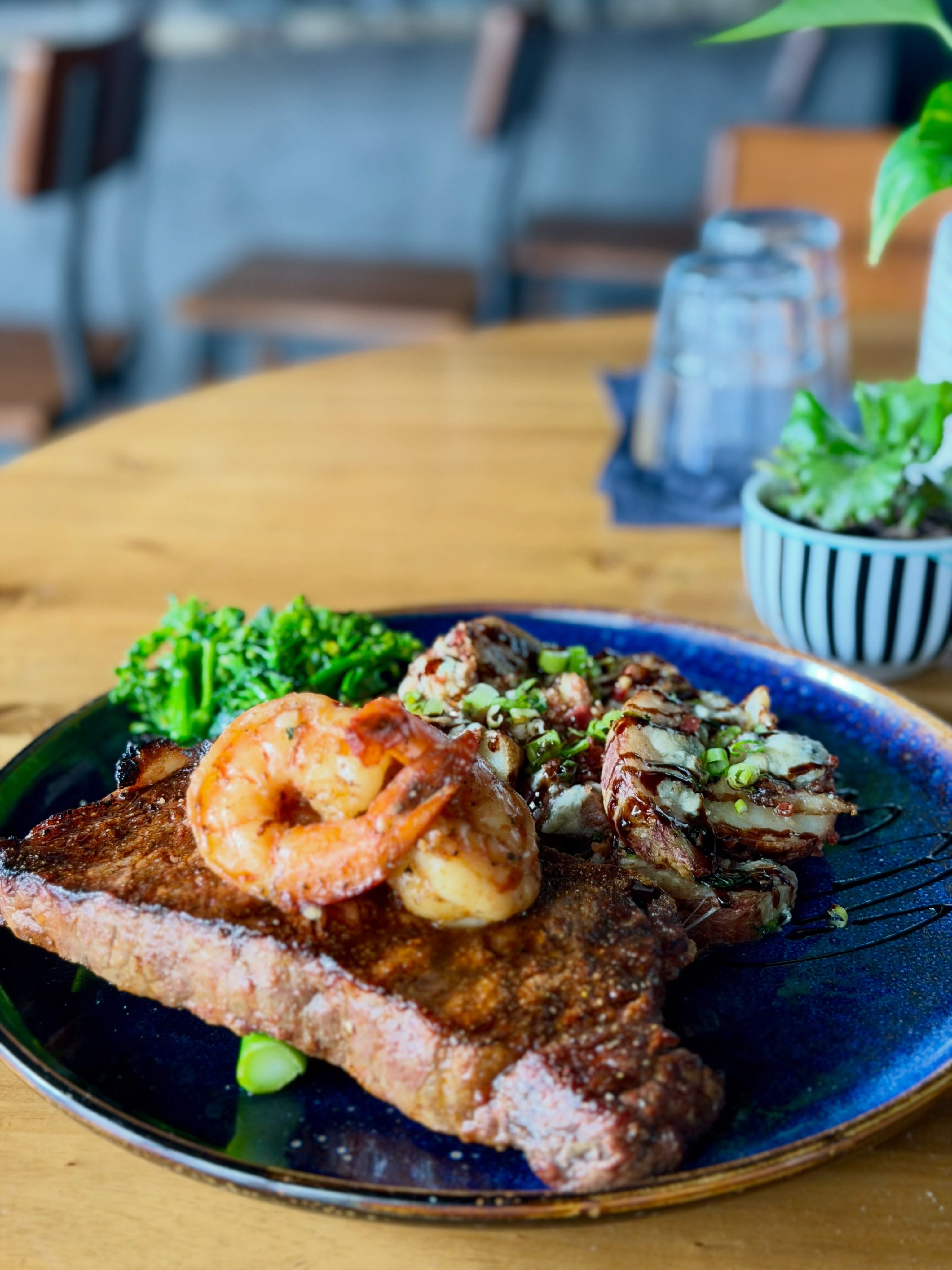 Dinner Feature:
Grilled Prime NY Strip topped with butter poached shrimp, garlic broccolini and roasted red bliss potatoes with smoked bacon, blue cheese, scallions & balsamic reduction