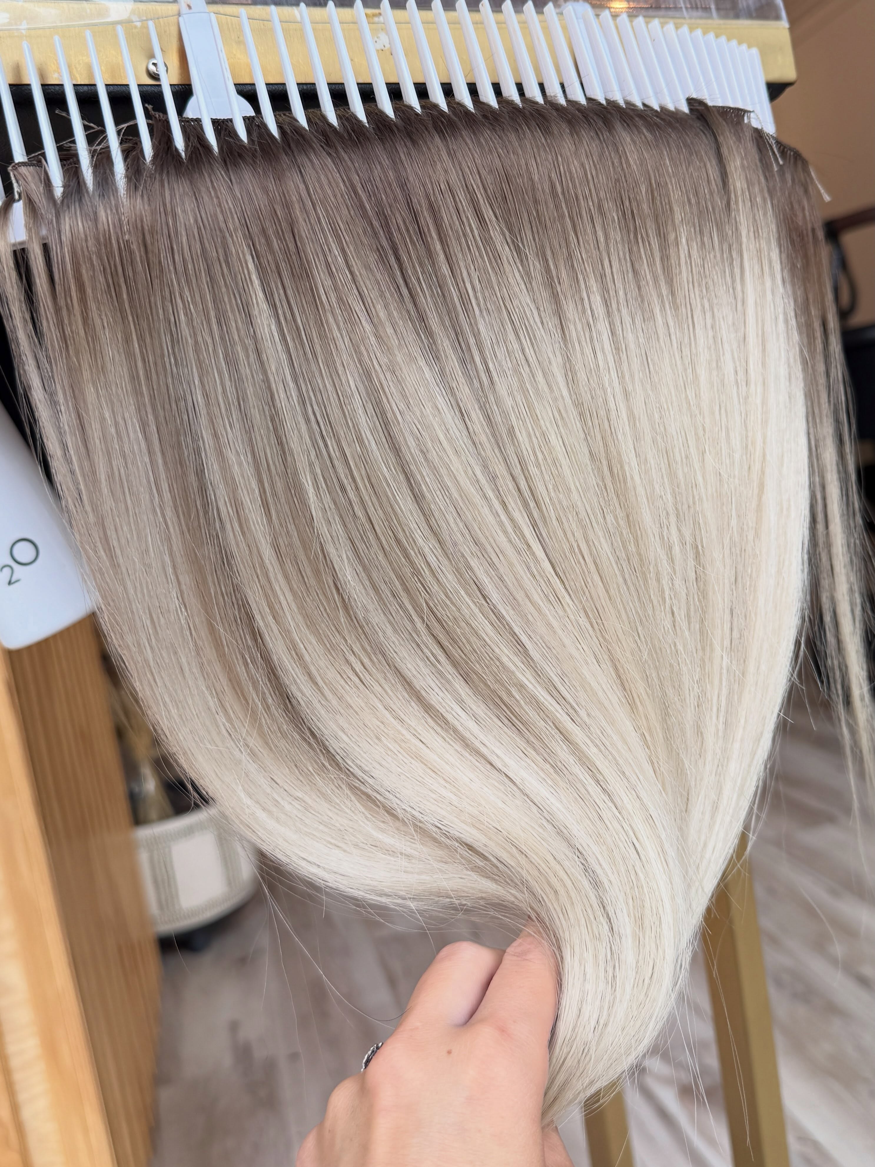 With extensions becoming a normal part of the world these days, I’m always surprised when a new client tells me that their extension hair was never colored or refreshed by their last stylist.
There have only been two instances in my entire career where the extension wefts were a truly perfect match to the client and no adjusting needed to be done. But even then, those same wefts needed to be refreshed and colored eventually to reset them back to their original shade. The color blend should be continued to be checked in on throughout your time wearing them.
I love having a new client in and transforming the wefts they have already been wearing into their highest potential with custom coloring!
If you want extensions that truly disappear into your own natural hair, it’s time to book that consultation!