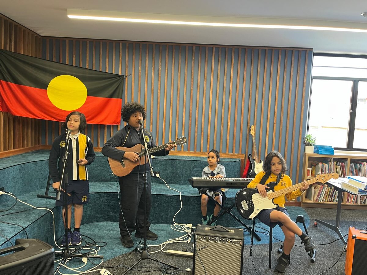 In music we’ve been celebrating NAIDOC week. We have been learning about Popular Aboriginal and Torres Straight Islander musicians and their songs. We have explored the meaning behind the works of Yothu Yindi, Christine Anu and Baker Boy and have explored their connections to culture.
❤️💛🖤
St Michael’s students have also learnt about some traditional instruments which are specific to Indigenous Culture. We have explored how people use music, song and dance in celebrations, songlines and sacred ceremonies to pass down laws and knowledge.
💙💚
In years 3-6
we have also begun to workshop and play our version of “Treaty” by Yothu Yindi on band instruments.
The celebration and learning has been enhanced by our very own resident Indigenous band which I’m sure you all saw on this page last week.🎸🎹😊