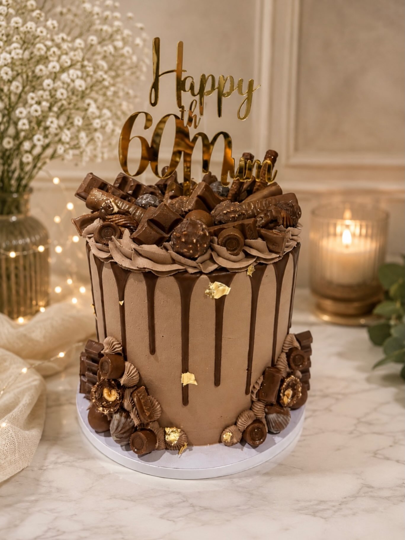 Now let’s have a choccy cake, I mean it was loaded with so many varieties of chocolate’s !!! And of course a chocolate cake filled with chocolate 🍫buttercream and dairy milk !!!
This one was for Tracy’s 60th, Happy Birthday 🥳 and finished with a topper from @prettypressedvinyl