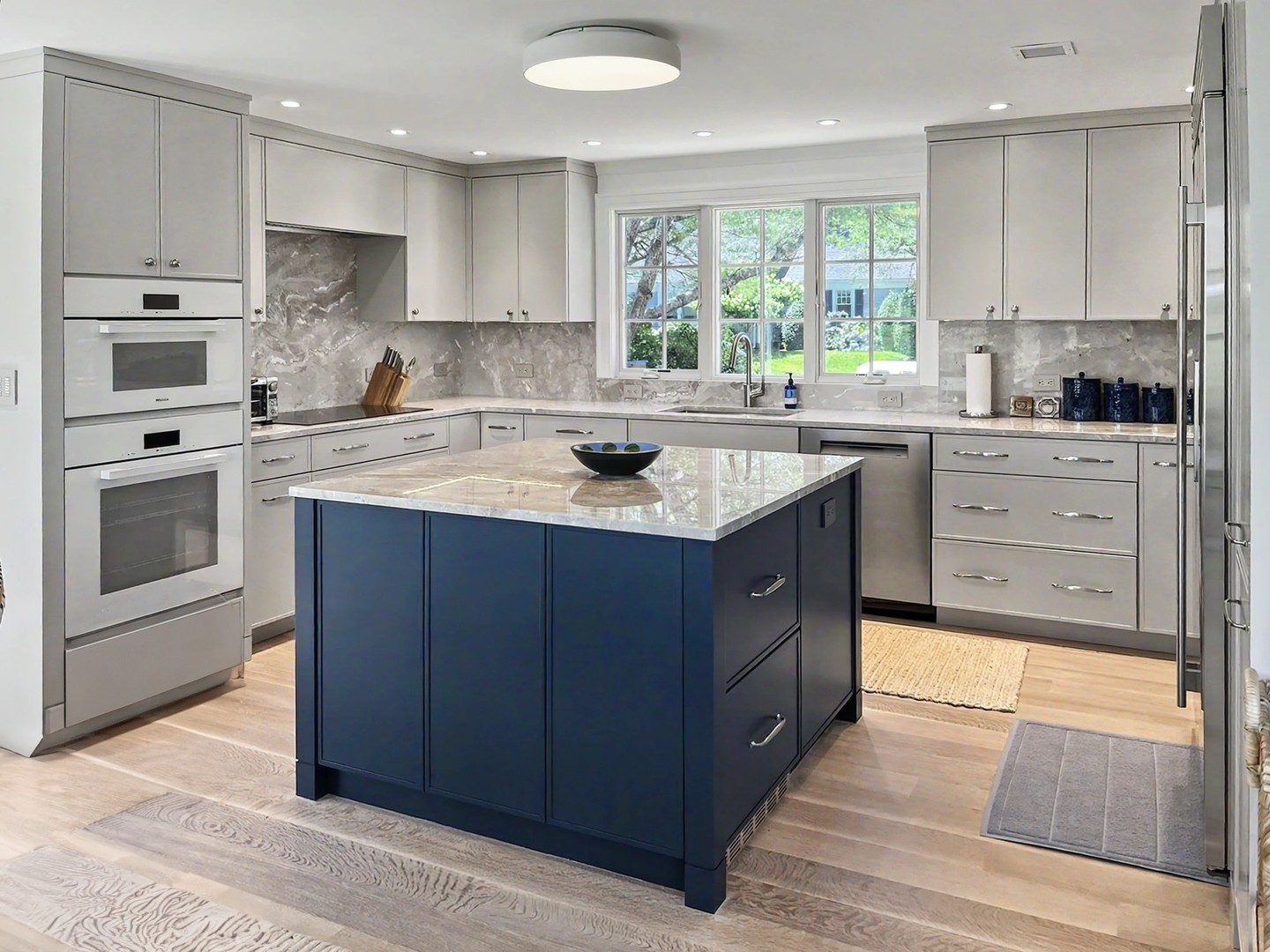 A kitchen designed around the way a home is truly lived in.
For this renovation, our in-house team managed every stage of the process, from the initial design and spatial planning to the custom cabinetry, craftsmanship, and installation. The result is a kitchen that feels collected and cohesive, with crisp white perimeter cabinetry, warm wood accents, glass-front display storage, and a deep blue island that gives the room a confident focal point.
Each detail serves a purpose. Generous drawers keep everyday essentials within reach, tailored storage creates a sense of order, and the layered finishes bring depth and character without overwhelming the space. It is a thoughtful balance of beauty, function, and enduring Cape Cod style, created entirely under one roof by Cape Associates.
Explore our custom design and cabinetry services and discover what an integrated, in-house approach can bring to your home:
https://www.capeassociates.com/custom-design-and-cabinets
#CapeAssociates #CapeCodKitchens #CapeCodRenovation #CustomCabinetry #KitchenRenovation #KitchenDesign #CapeCodHomes #CustomKitchen #FineCraftsmanship #BuiltInHouse
