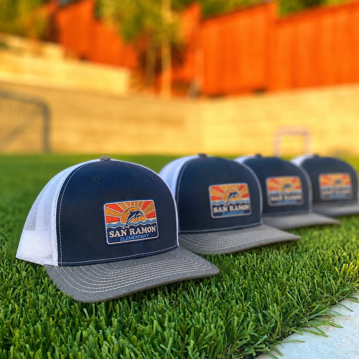 New school year, new gear 🐬☀️🌊
The new San Ramon embroidered patch trucker is coming in 4 styles — two classic Richardson options plus two vintage styles in burnt orange + navy. Something for everyone! On sale at @sanramonpta and online (link in bio)
#schoolspirit #novatocalifornia #buildingcommunity #bmisports #marincounty