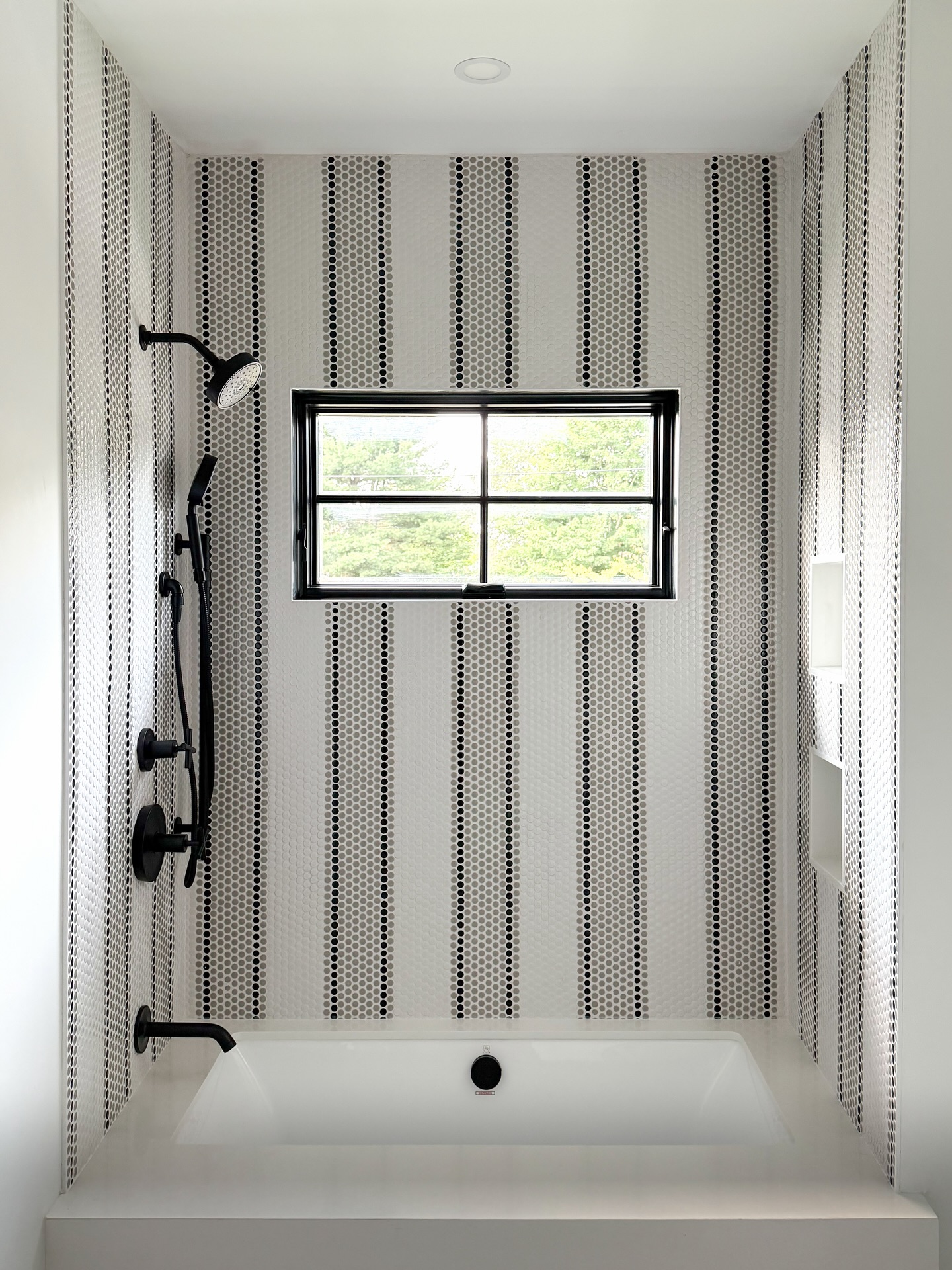 A little pattern goes a long way.
For this Harbor View Park bathroom, classic penny tile takes on a more playful point of view. The custom striped pattern carries from the floor into the shower, creating a continuous design moment that draws your eye through the entire space.
Paired with a soft gray vanity, crisp white surfaces and matte black finishes, the result feels clean and timeless with just enough personality.
Proof that even the smallest spaces deserve a memorable design moment 🙌🏼
#BostonInteriorDesign #BathroomDesign #TileDesign #InteriorDetails #modernbathroomdesign