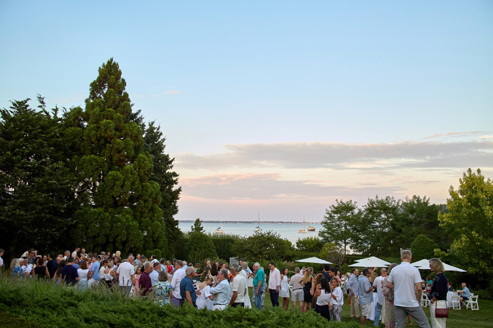 We wish to thank everyone who attended and contributed to the Bellport Village Program Fund’s Cocktails By the Bay on Saturday August 8. It was very gratifying to see such widespread support for the work that the BVPF does for our wonderful Village.
The positive energy and upbeat vibes were great to see: old friends and new faces enjoying each other’s company, the beautiful setting, and the common goal of helping to make Bellport an even better place to live.
Thank you for being a part of a wonderful evening. For those of you unable to attend or buy tickets, it is not too late to donate to the BVPF to help us continue what we do! Please visit the link in bio. Cocktails by the Bay will return on Saturday, August 7,2027! See you then!