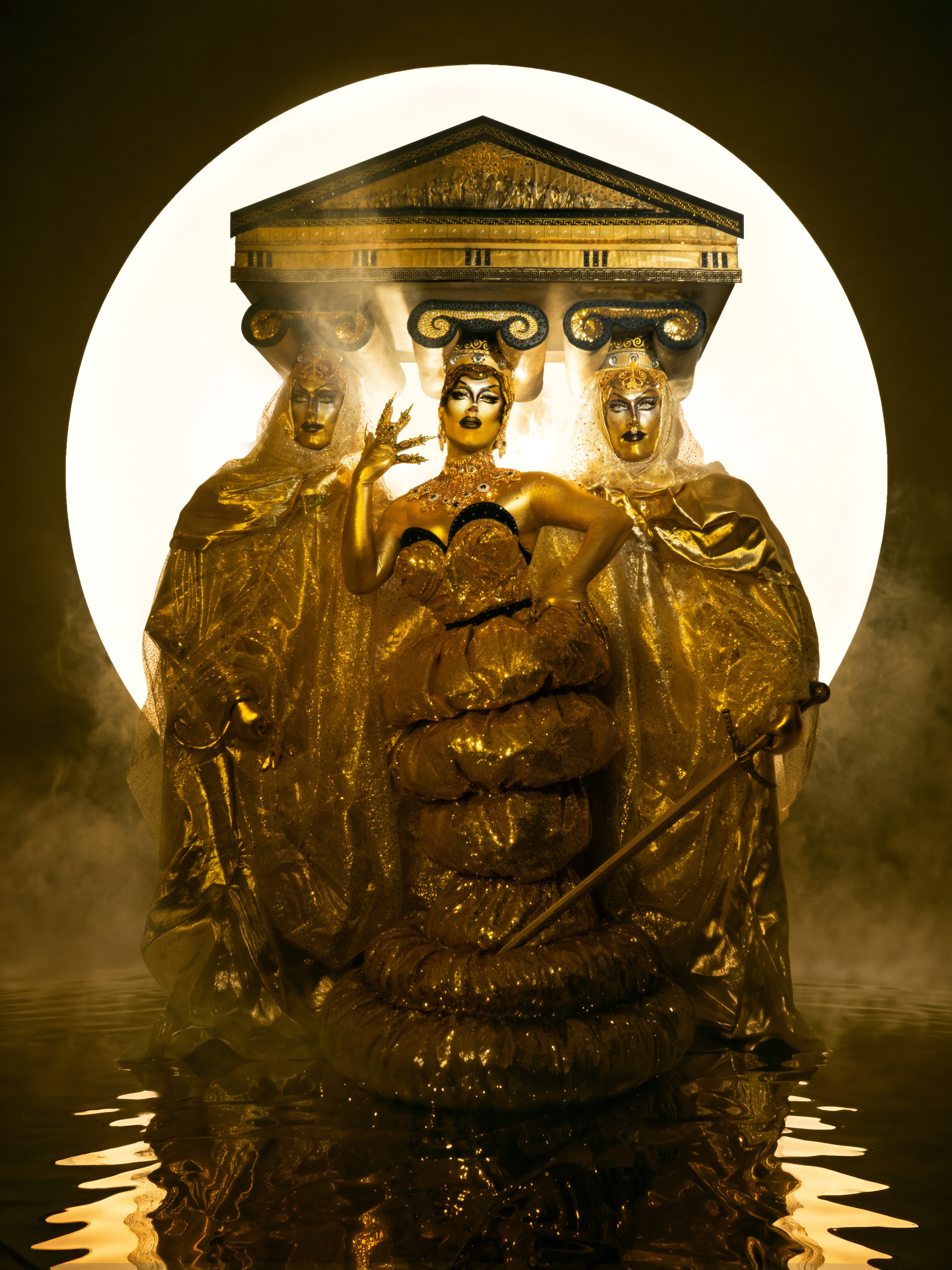 Full circle. Or should I say… full temple. 🏛️✨
On the finale of Canada’s Drag Race Season 2, I walked onto this stage as a silver column. Three seasons later, I knew there was only one logical way to return: as the entire temple!
This finale look is about coming back complete. Three bodies. Three versions of myself: past, present, future. Inspired by the ancient three bodied Greek goddess Hecate, goddess of magic, crossroads, power and possibility. A figure who stands between what was, what is, and what is yet to come. Keeper of her own destiny. Carver of her own path.
After three seasons, there is something beautifully full circle about ending this chapter here. I came back thinking I had something left to prove, but the lesson in learnt was that I never did.
Sometimes you don’t need a reality show to tell you that you’re a star. 😉 Sometimes you’re simply a powerful primordial goddess that exists beyond all planes! 🤷♀️
And that is my destiny.
I am so incredibly proud of my sisters and of everything we created this season. Thank you to @canadasdragrace for inviting me back into this beautifully insane world once again and giving me another opportunity to show you who Pythia is.
And thank you to my incredible friends, my chosen family, @jojormungandr who assisted me day and night in all the looks you saw this season, and especially the love of my life, @george_kerasias, who poured himself into this journey with me from start to finish. The package, the shoots, the photographs, the videos, the behind the scenes chaos and every ridiculous idea that somehow became real. None of this exists in a vacuum, and I will never forget the people who helped me build this universe.
A very special thank you to George’s dad, Tom, who tirelessly helped me engineer the base of this absolute MONSTER of a headpiece. I genuinely think this might be one of the biggest headpieces ever worn across the Drag Race franchise!!!
The finale may have aired, but this story isn’t finished. There is still so much from this journey that we created, documented, filmed and photographed that I cannot wait to share with you.
📸 @george_kerasias @ioniqo.creative