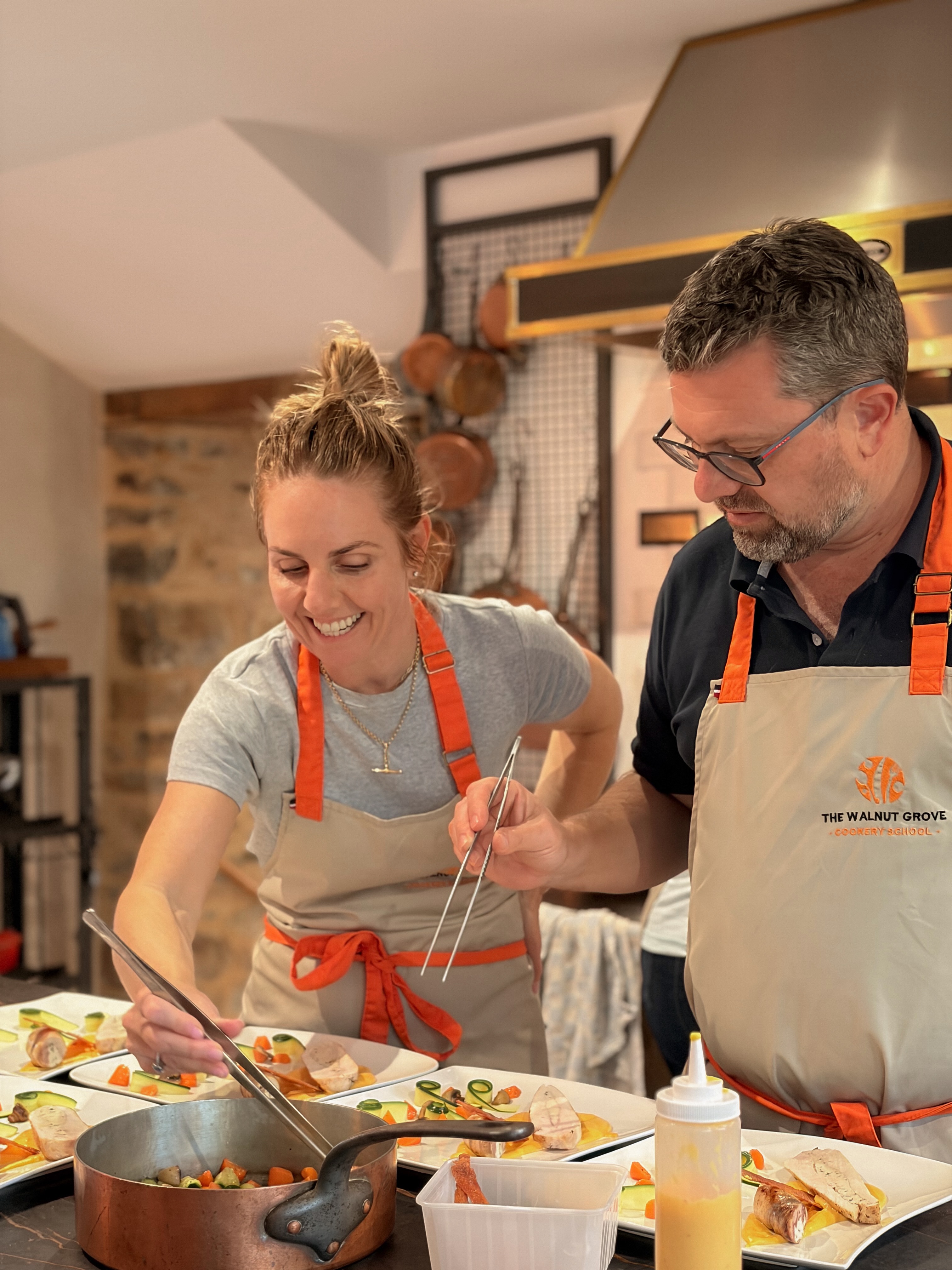 Imagine spending a summer day in a French farmhouse kitchen, learning the kind of cooking skills you’ll carry home with you for years.
Today, the lesson begins with a whole chicken.
With Chef Eric guiding the way, our guests learn how to properly butcher the bird, understand each cut, and discover how one simple ingredient can become several beautiful preparations.
The chicken breast is cooked sous vide until perfectly tender and wonderfully moist. Another portion becomes an elegant ballotine. The skin is transformed into crisp, golden shards, adding that irresistible contrast of texture.
And then, the garden comes into the story.
A smoky, velvety sweet potato purée. Bright summer vegetables picked fresh from the garden. Tender chicken, crisp skin, and layers of flavour coming together on one beautiful plate.
This is what we love about cooking at Walnut Grove Cookery School.
You don’t simply learn a recipe.
You learn the why behind it. You learn techniques you can take back to your own kitchen. You slow down, work with your hands, cook with the seasons, and share a meal that you helped create from beginning to end.
And when you sit down at the table, surrounded by the French countryside, the food tastes just a little more special.
Because you made it yourself. 🇫🇷🌿