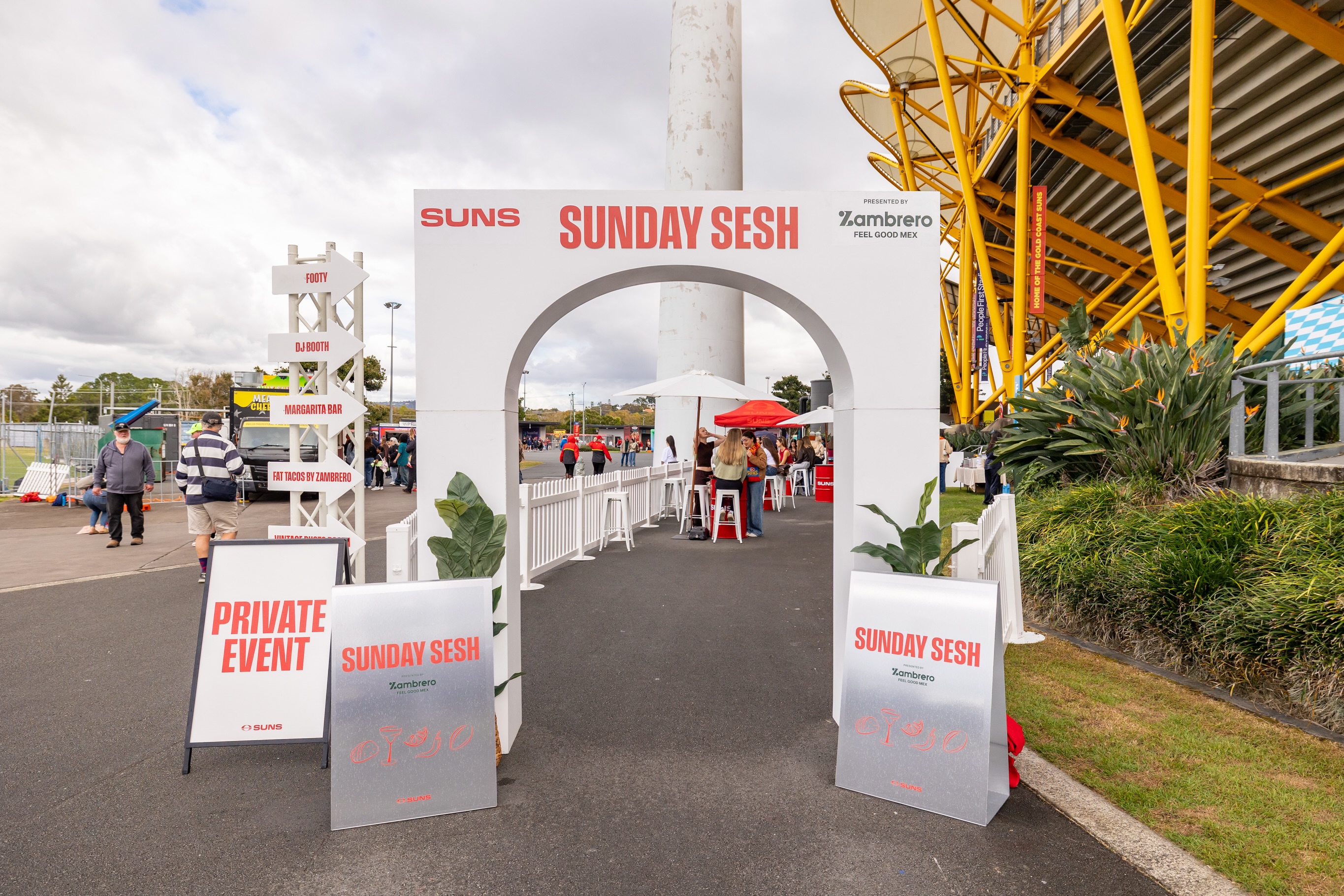 🌮TACOS & FOOTY ☀️ When the @gcsuns and @zambrero asked us to build a unique activation for People First Stadium, we knew we had to bring a modern, sleek edge. We brought the space to life using custom brushed aluminium for the A-frames and DJ surrounds, paired with iconic Suns red and white oil drums fitted with custom toppers and decals.
Finished off with entry statement arches, perimeter fencing, fresh tacos, and cold margaritas—Sunday at the footy doesn’t get better than that! We really took the vibe part of @architectsofvibeau and threw it all into this activation.. because honestly, sleek modern designs and tacos are a whole vibe! Did you get to visit this or get a snap in the @the_boothclub let us know below! 👇🏻 Also, curious, what’s your Zambrero order?
Photos, collaborators, location: @novasoma_photography @shesspicy_ @zambrero @gcsuns @the_boothclub @peoplefirststadium #goldcoastsuns #goldcoastevents #goldcoastactivations #sundaysesh #eventhire