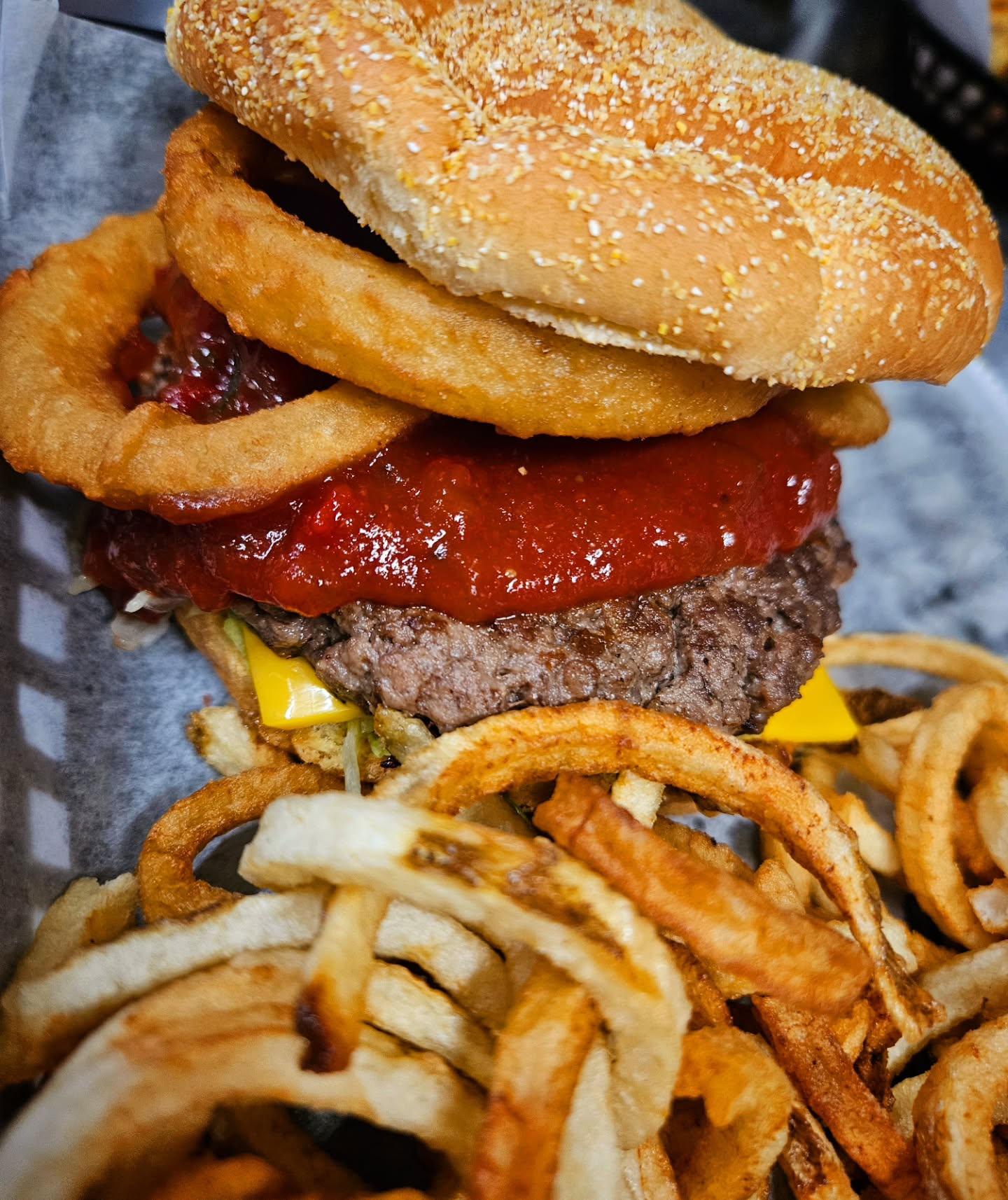 It's called Wondersauce. No, it's not ketchup and relish. It's a process. It has tomatillos and sugar (among other things). It originated in Texas and was meant to be more of a salsa than anything else. It's what makes the Wonderburger different from all our other burgers. This is the BIG WONDER featuring all the toppings of our traditional Wonderburger but amped up with Onion Rings and a half pound beef patty! 🍅❤️🐮