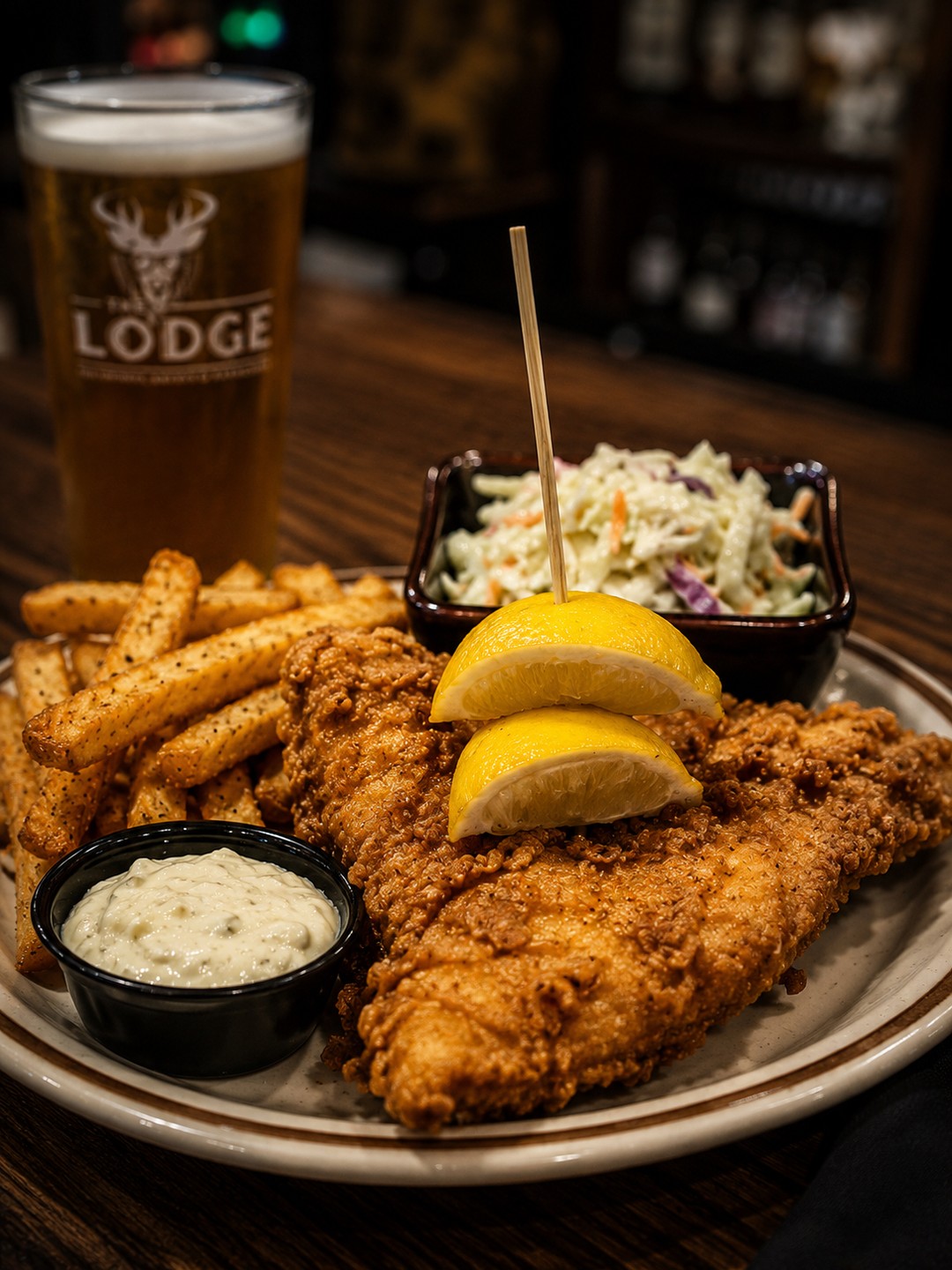 Fish Fry Friday is calling. 🐟🍋
Crispy beer-battered fish, fries, coleslaw & tartar sauce — served up every Friday at The Lodge.
Late night drinks happy hour 8pm-close
#TheLodge #FishFryFriday #DowntownFortMyers #FortMyersFood #FridaySpecial #SWFLFoodies