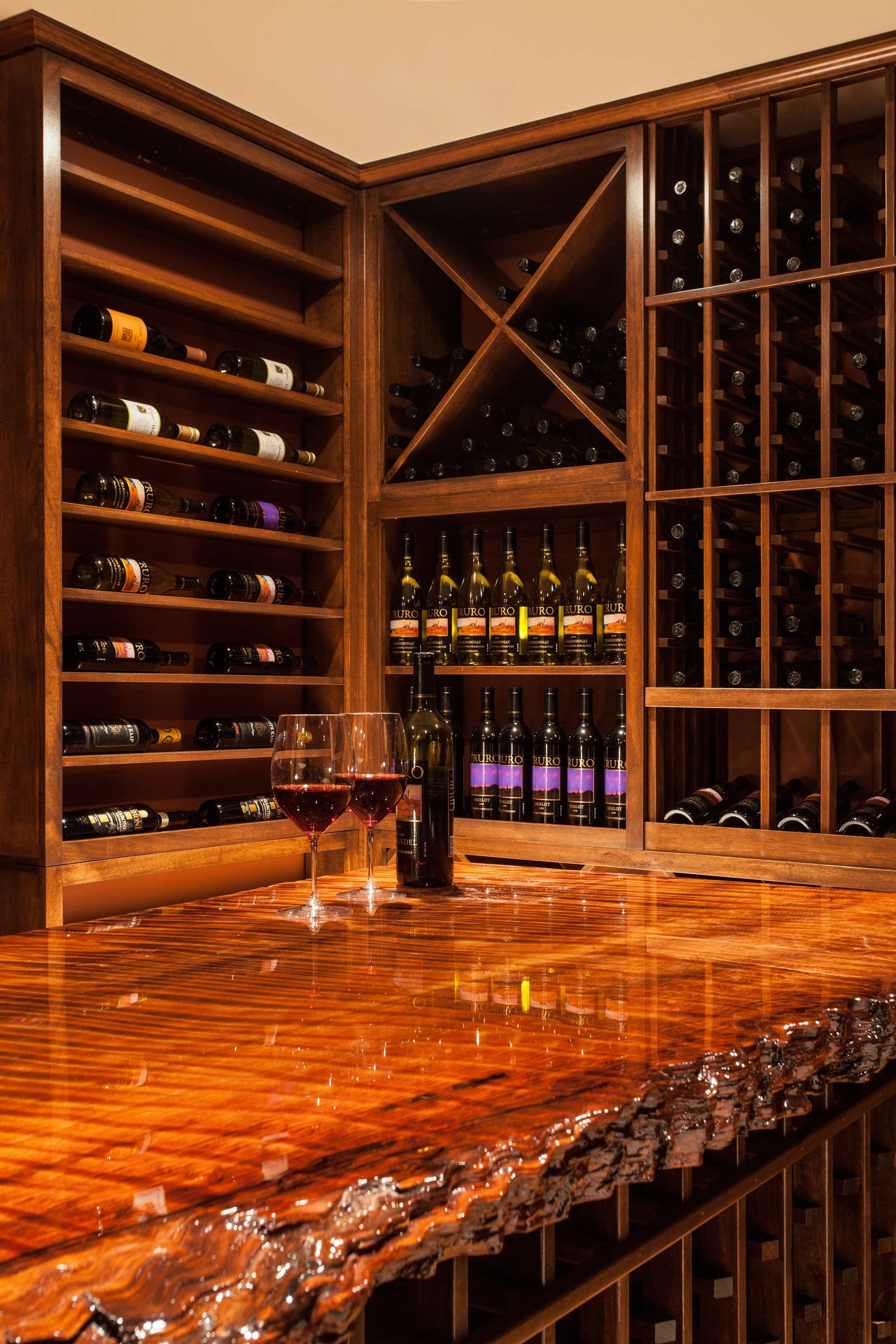The beauty of a custom space is found in the details. This Truro wine cellar pairs floor-to-ceiling millwork with tailored built-ins, curved cabinetry, decorative glass, and a one-of-a-kind tasting table. Designed by the Cape Associates team, it brings warmth, function, and a refined sense of craftsmanship to this Cape Cod home.
Photography by: Dan Cutrona
#CapeAssociates #CapeCodHomes #TruroMA #CustomHomeBuilder #CapeCodDesign #WineCellarDesign #CustomMillwork #BuiltInCabinetry #FineCraftsmanship #InteriorRenovation #CustomInteriors #ArchitecturalDetails