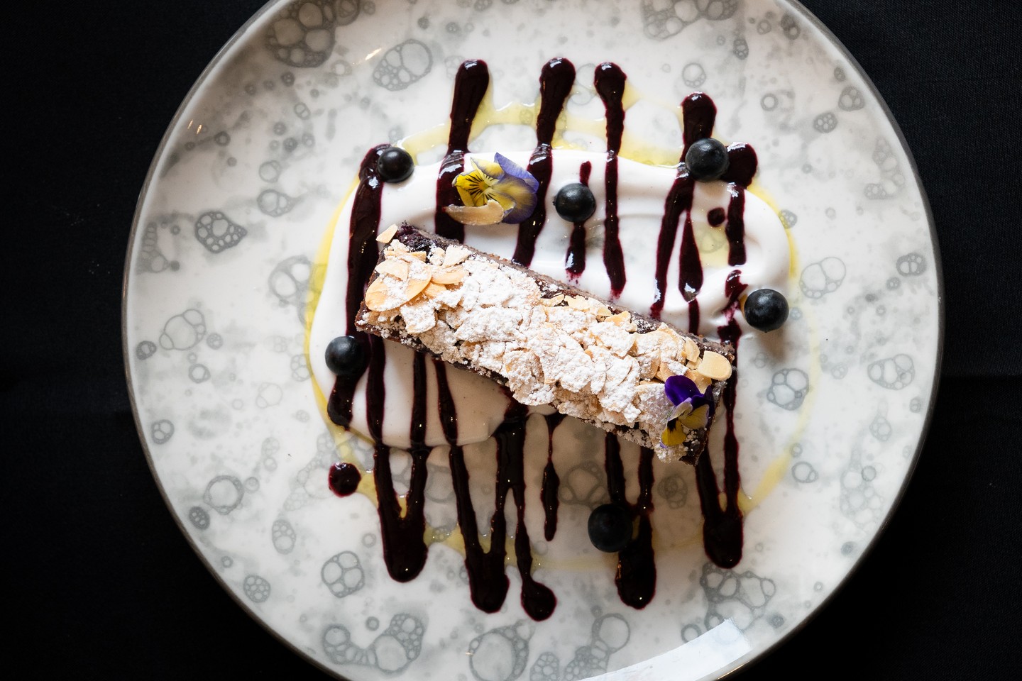 Almond gateau is built on an almond meal base, which puts it closer to French patisserie than a cake. The texture is denser, moister, the kind of thing you'd find in a Parisian cake shop rather than on a restaurant menu.
Blueberries are baked through rather than scattered on top, so every slice gets them. Coconut cream and a blueberry coulis alongside.
On the dessert menu now at Glen Erin at Lancefield.
#GlenErinAtLancefield #MacedonRanges #MacedonRangesRestaurant #LancefieldVIC