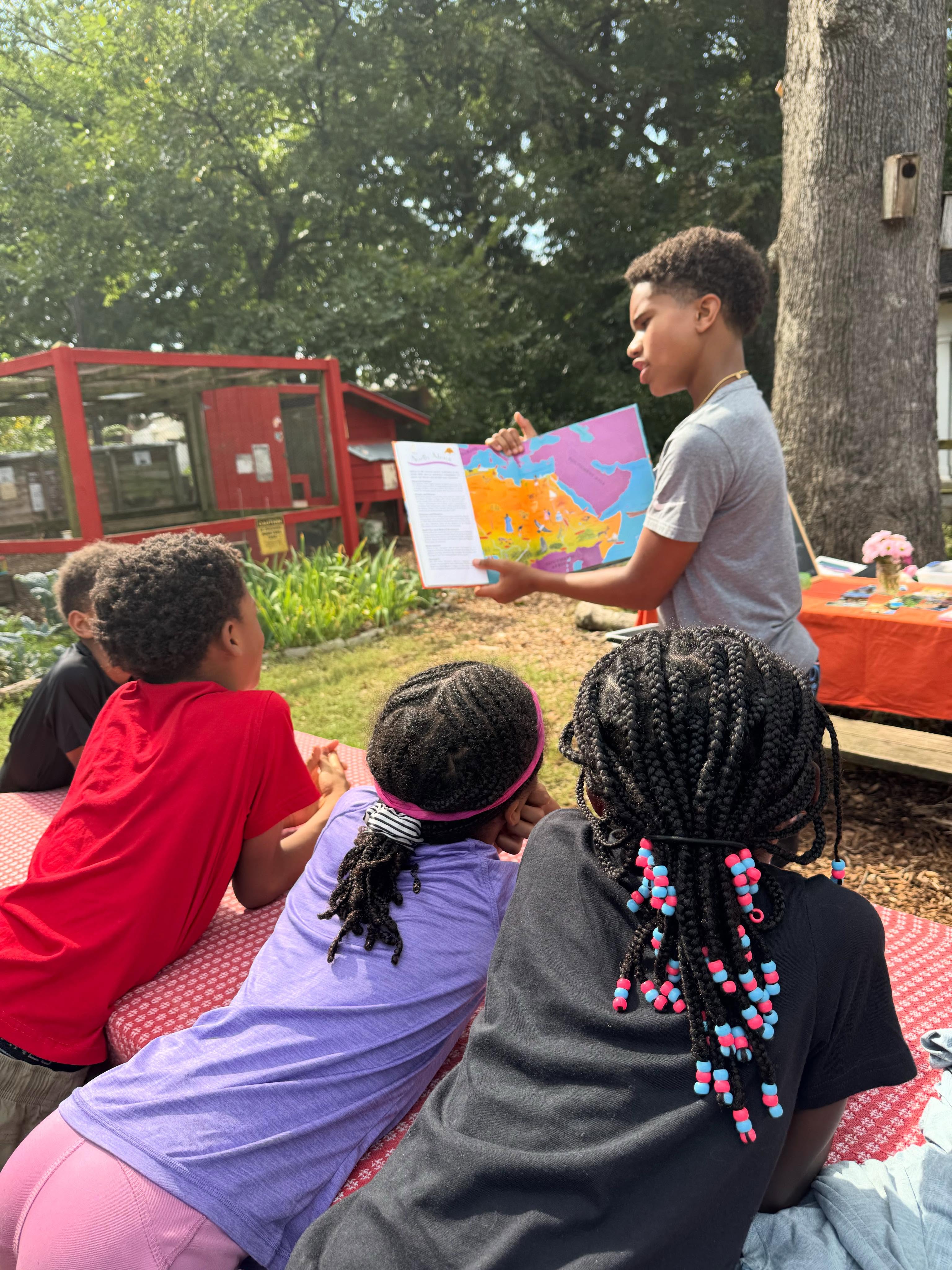 In January, we made a decision that’s turned out to be one of our best: inviting our Gather graduates back to teach alongside us as Junior Guides.
Here’s what we learned early on — it takes a special kind of human to want to be outside, rain or shine, teaching, reading, making art. And it takes even more perspectives in a day to truly benefit our children. So who better to guide the next generation of forest schoolers than the ones who grew up as forest schoolers themselves?
For our 13-year-olds, it’s a chance to choose their own expertise, dig deep into what they love, and build a curriculum from the ground up — real leadership experience, real ownership, and a head start on the kind of initiative colleges look for. For the children still in our program, it means more mentors, more voices, and lessons taught by someone who was recently sitting right where they are.
It’s mutually beneficial in the truest sense — and we couldn’t be prouder to watch it unfold.