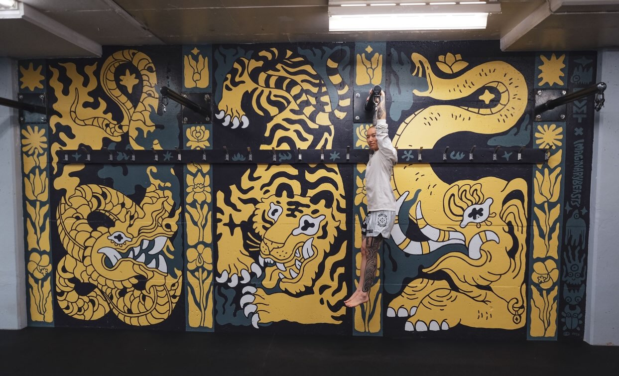 I’m so in love with this mural Ris ( @demonography )finished at the gym today! Thank you so much for adding another incredible piece of artwork to our space.
EVMT is home to so many incredibly talented artists, and I feel so lucky to be surrounded by their work every day.
Our gym is looking pretty cool these days 😎