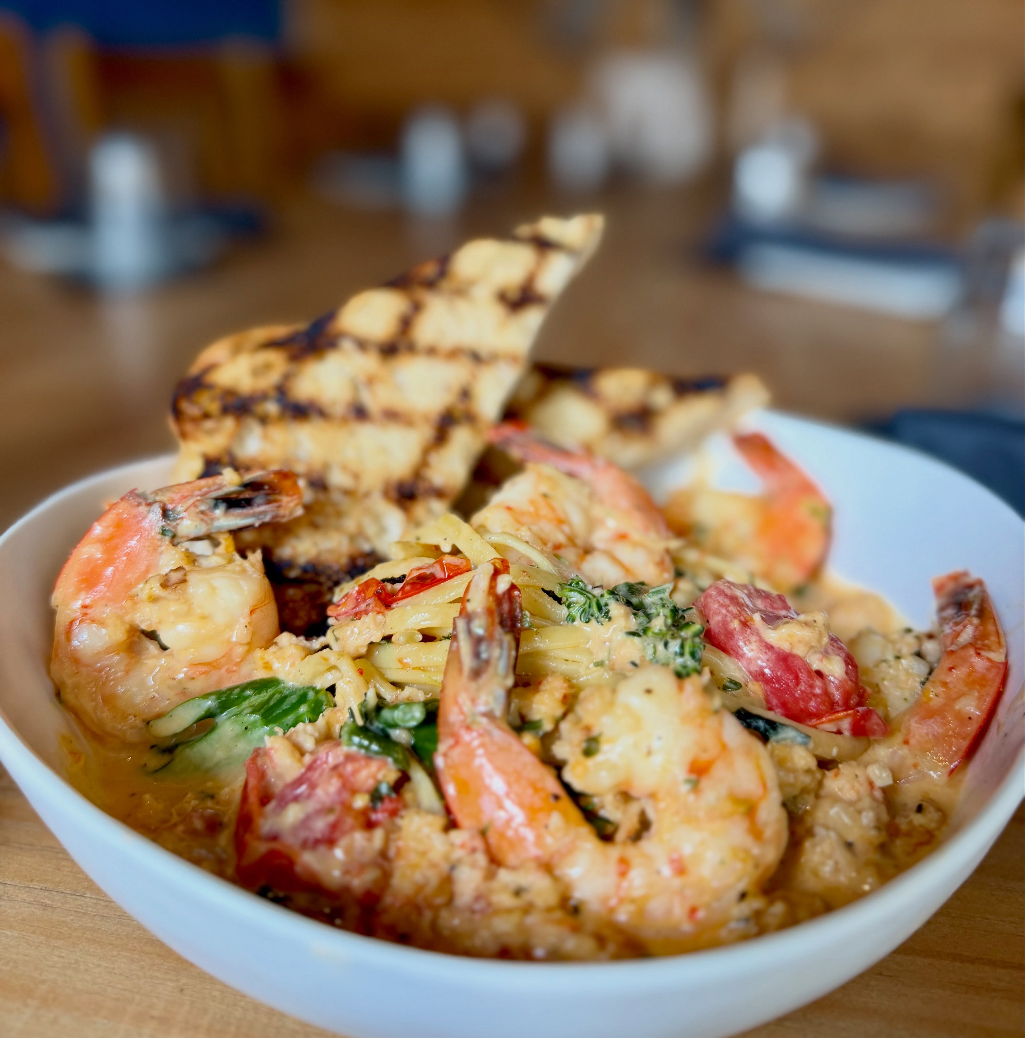 Dinner Feature: Shrimp & Lobster Linguine
Sautéed shrimp with chopped broccolini & roasted grape tomatoes in a creamy white wine Parmesan cream sauce with lobster & Calabrian peppers served with a grilled garlic bread