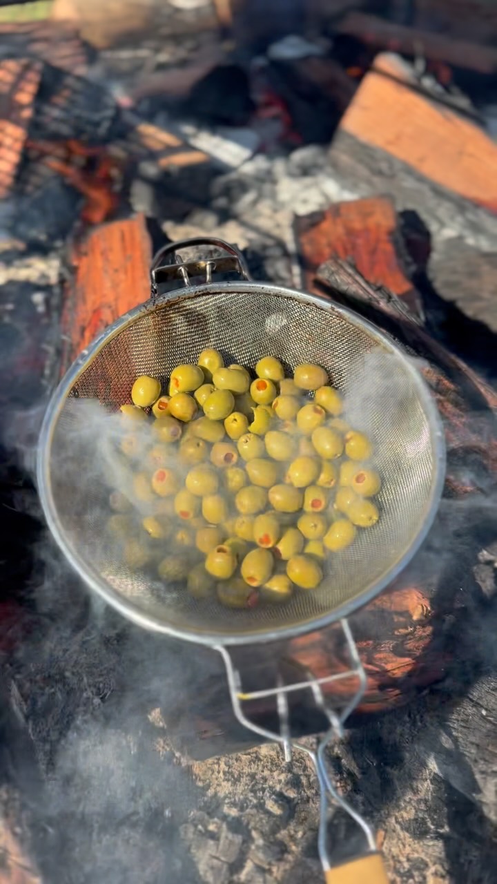 Coal smoked olives for the win . Used as a garnish or simply as a snack on the grazing table 🔥