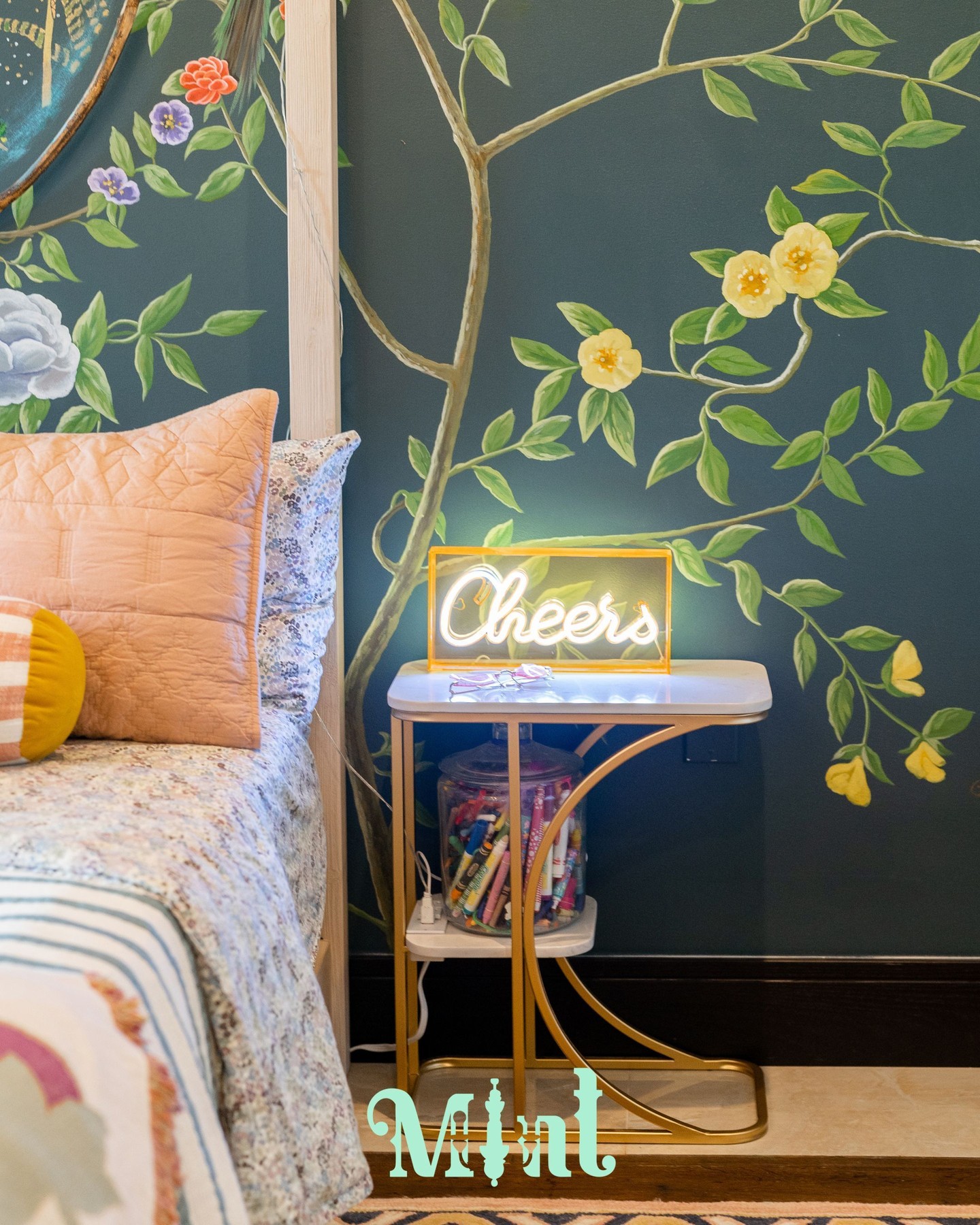 It's always the details that make a room feel complete. The "Cheers" neon sign glowing beside the bed. The gold sunburst chandelier catching the light overhead. The canopy frame strung with fairy lights that make the whole room feel like a celebration. These are the finishing touches that take a beautifully designed space and make it unforgettable.
Designing spaces that truly belong to the person living in them is one of my greatest joys. If that's what you're looking for, reach out through the link in bio.