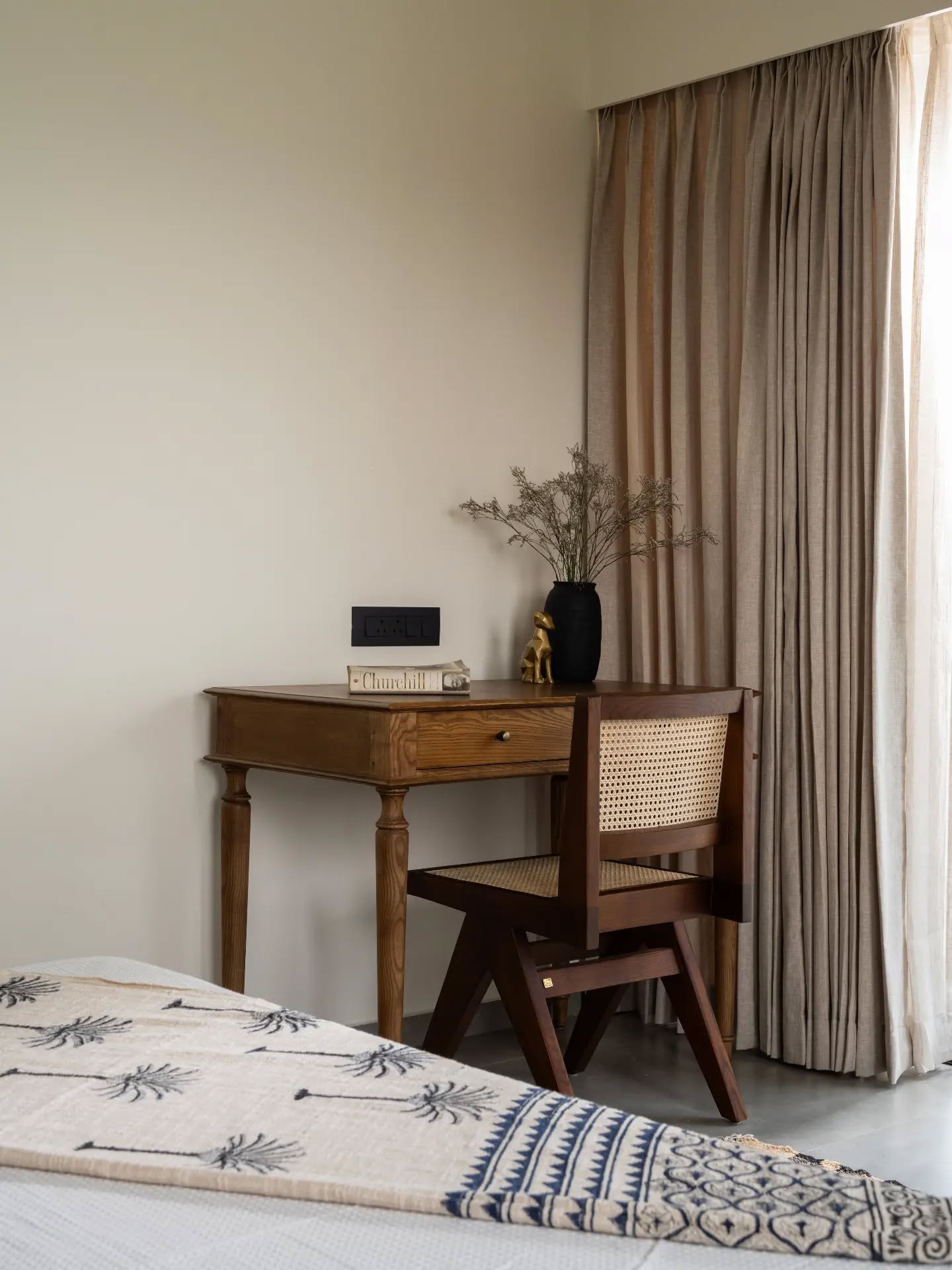 A dedicated corner that blends function with character. The writing desk, woven chair and carefully chosen objects create a warm little retreat by the window, with soft curtains adding to the calm and understated mood of the room.
Architect: @designnarrative.in
Decor: @foundobjects.in
Photography: @nathanphotos.in
Luxury furniture, handcrafted furniture, premium wood finishes, bespoke furniture, designer furniture, contemporary interiors, custom furniture, wooden craftsmanship, timeless design, elegant living, home interiors, The Lofts