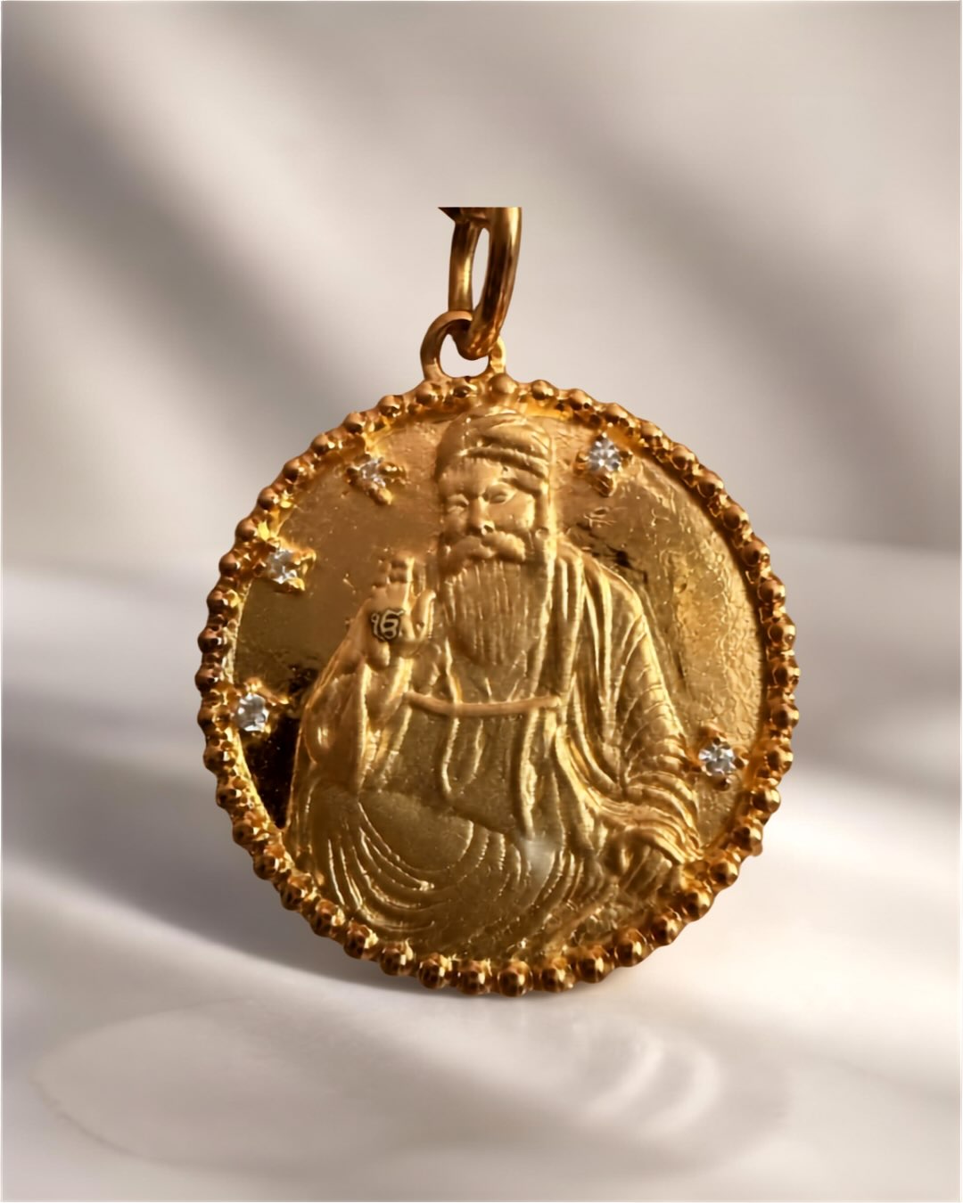 Guru Nanak Dev Ji — a journey of faith, courage and compassion. ✨
Born in 1469 in Punjab, Guru Nanak Dev Ji was a spiritual teacher whose message challenged division, inequality and religious boundaries.
Following a profound spiritual awakening, he travelled extensively across India and beyond, engaging with people of different faiths and traditions. His journey was one of discovery, dialogue and a search for truth — sharing a simple but powerful message: there is one Divine presence, and humanity is one.
His teachings encouraged us to live honestly, share what we have, serve others and see the Divine in all.
Our Guru Nanak pendant is inspired by that extraordinary journey — a piece created not only to honour his legacy, but to carry a message that remains as relevant today as it was centuries ago.
One Creator. One humanity. A journey of love, equality and truth. 🤍
#MangoLuxe #GuruNanakDevJi #GuruNanak #Sikhi #IkOnkar OneHumanity Equality Seva JewelleryWithMeaning PunjabiHeritage MeaningfulJewellery MangoLuxeJewellery