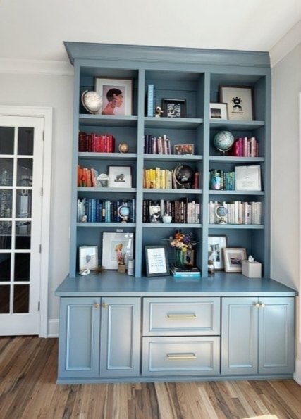 We've said it before, and we'll say it again... we LOVE when our clients send us photos after they've made the space their own. 💙
A beautifully crafted built-in is only part of the story. Once it's filled with favorite books, family photos, keepsakes, and pieces that reflect the people who live there, it truly comes to life.
This custom home office, finished in Van Courtland Blue with brushed gold hardware, was designed to maximize a smaller space without sacrificing style or storage. Now it's not just a workspace—it's a space that's uniquely theirs.
Thank you to our wonderful clients for sharing this photo with us. There's nothing better than seeing our work become part of your home.
#CustomBuiltIns #HomeOffice #BuiltInBookshelves #CustomCabinetry #InteriorDesign #HomeOfficeInspiration #Craftsmanship #NorthCarolinaHomes #BeforeAndAfter #StyledShelves