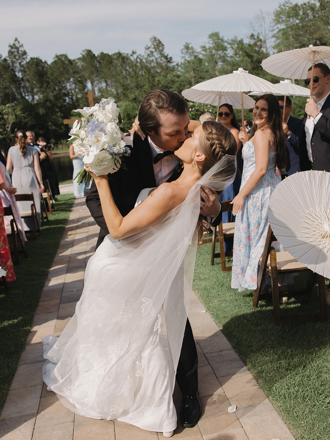 Mr. & Mrs. Siefker
EST 5.16.2026 ✨
An elegant, classic, and timeless celebration in shades of white, green, and light blue — with the sweetest nod to a love story ten years in the making. 🤍🩵
High school sweethearts Anna & Paul have been together for ten years, making their wedding day at The Manor at 12 Oaks the perfect celebration of everything that brought them to this moment.
Their outdoor ceremony took place overlooking the water, with a simple wooden cross adorned with lush white and blue florals creating a meaningful focal point against the natural landscape. Surrounded by their closest family and friends, Anna & Paul exchanged vows before beginning the next chapter of their story as husband and wife.
And because ten years of memories deserved to be part of the celebration, guests were invited to take a walk down memory lane as they made their way from the ceremony to the reception — with photographs from each year of Anna & Paul’s relationship lining the path.
From the ceremony to the smallest details, every element was thoughtfully designed to celebrate where they’ve been, where they are, and where they’re going. ✨
Ten years down, forever to go. 🤍
Planning & Design: @kelsielizabethevents
Venue: @themanorat12oaks
Photographer: @sarahloganphoto
Videographer: @toastweddings
Floral Design: @thebluetulipflorals
Rentals: @posheventrentalsjax
DJ: @rjmentertainment
Photobooth: @bokehandbirchphotobooth
Bar Service: @dragonflyspiritsco
Catering: @thelocaljax
HMU: @braid_bar_sta @betsys.pro.makeup
Cake: @publix
.
.
.
.
.
.
.
#floridawedding #floridaweddingplanner #jacksonvilleweddingplanner #jacksonvilleweddings #classicwedding