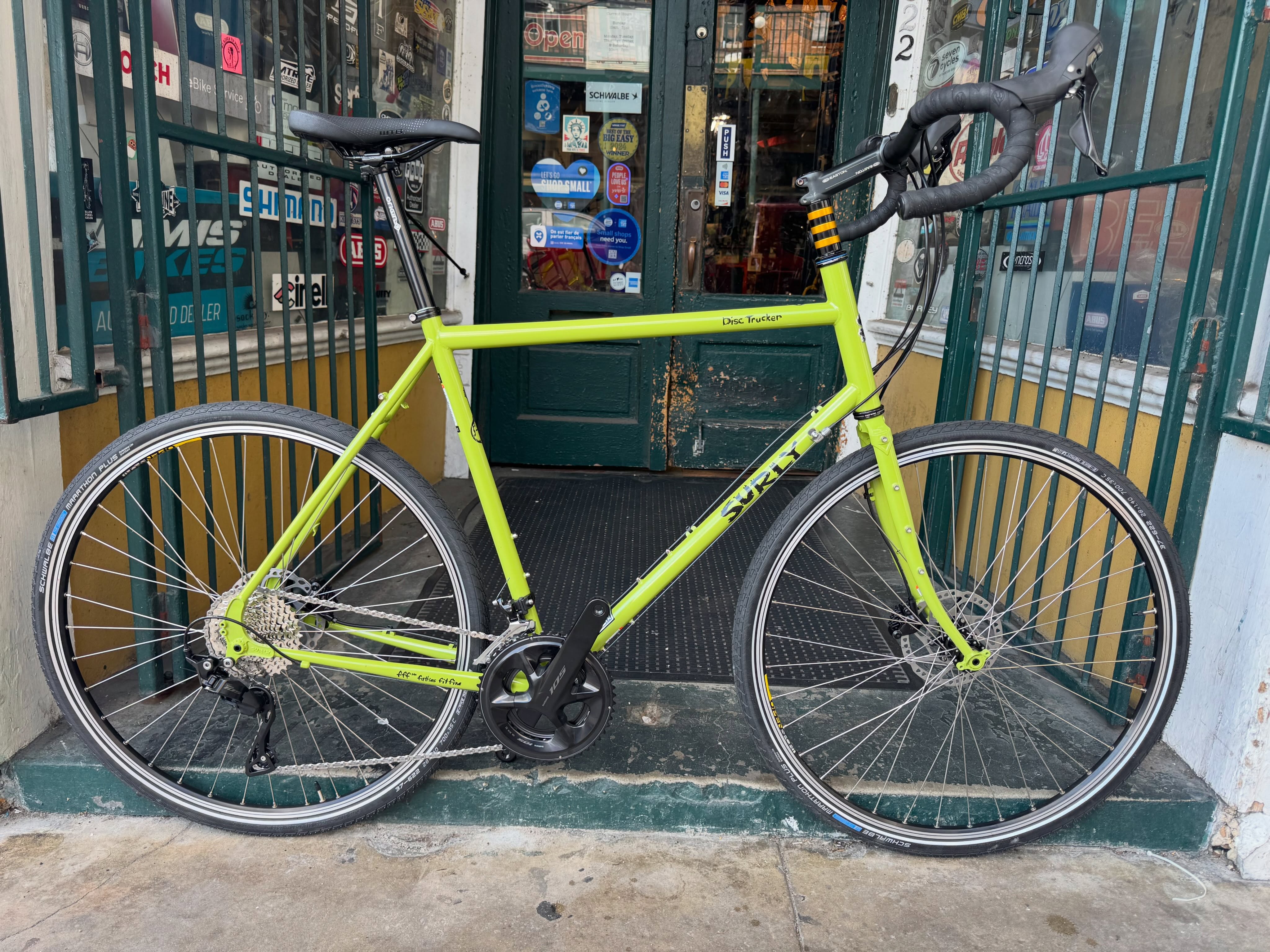 Hey tall people who are into a nice touring bike!!
Here’s a new Surly Disc Trucker 60cm in pea lime soup with a complete Shimano 105 group, hand-built wheels, Schwalbe Marathon Plus tires, Truck-Stop Handlebars, and the best warranty in the world!! Come check it out!!