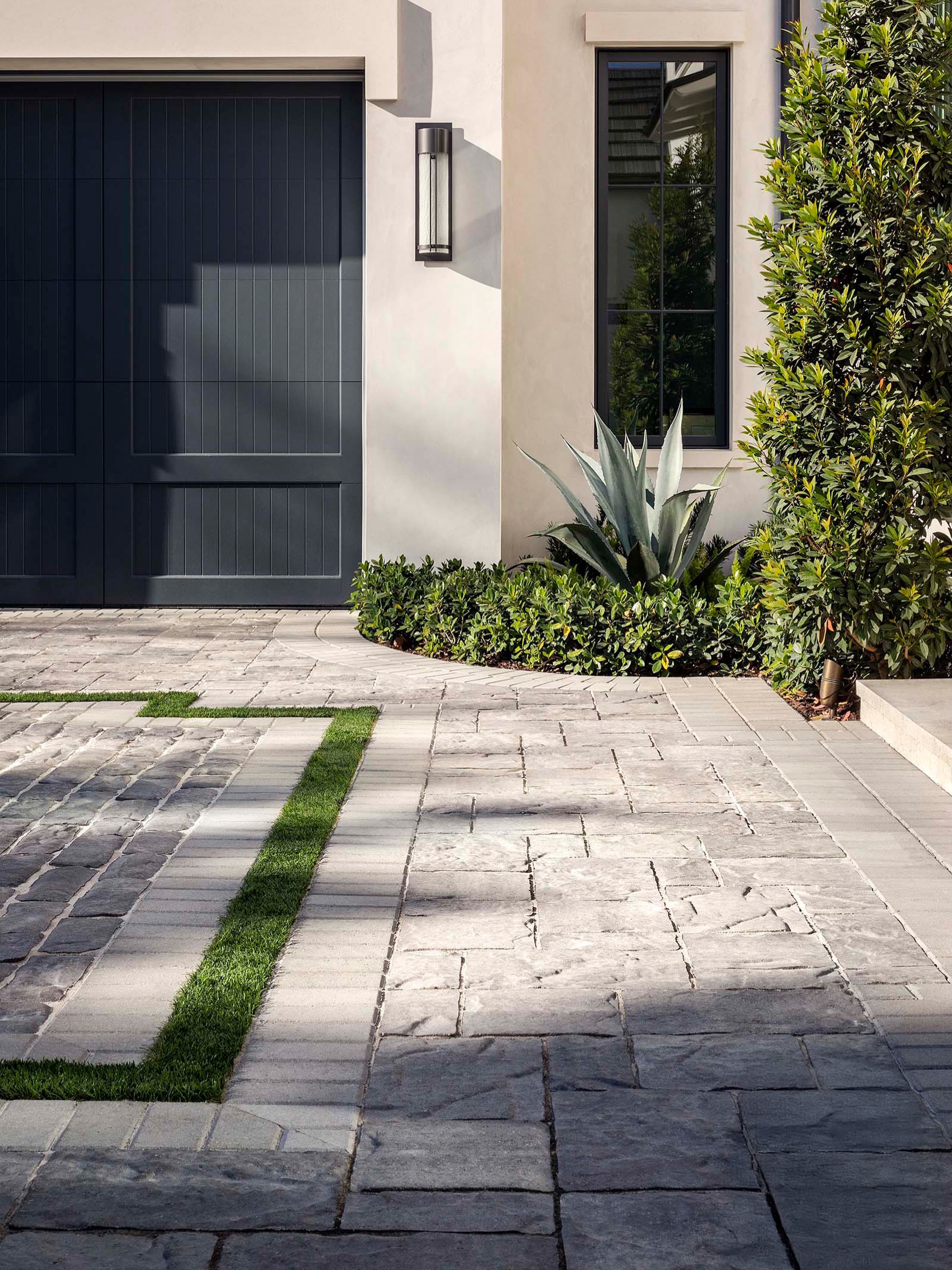 A driveway designed to make an entrance. ✨
We’re honored that this project was recently recognized by Florida Design Magazine for Best Driveway Design. A layered composition of richly textured pavers, crisp linear borders, and turf inlays creates a refined arrival that feels both architectural and integrated with the landscape.
Thoughtful details at every scale transform a functional necessity into one of the home’s defining design moments.
#OutsideProductions #LandscapeArchitecture #DrivewayDesign #FloridaDesign #FloridaLiving