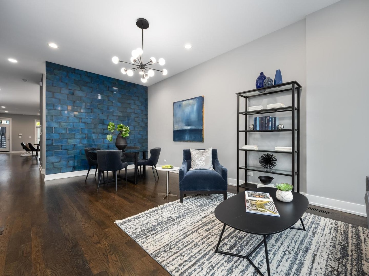 We used this bold blue accent wall as inspiration for the rest of the shared space. A couple of our tips for working with bold accent walls:
* Pair your bold color with neutral furniture — creams, grays, or natural woods to ensure the wall remains the focal point without overwhelming the space.
* To create visual harmony, introduce small accents of that same blue elsewhere in the room — a piece of art, a vase, books, etc. to tie the look together.
* Deep blues can absorb light, so ensure you have good overhead lighting and a floor lamp to keep the room feeling bright and airy.
#chicago #chicagorealestate #havenhomestager #chicagohomestaging #stagingworks #stagingsells #staging #homestaging