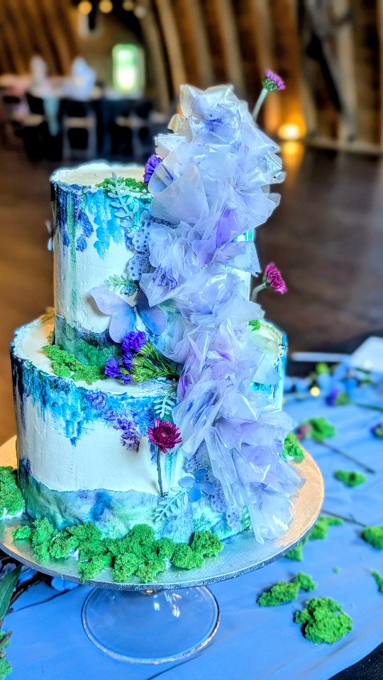 🌿💜 A farewell to the forest, the waterfalls, and the wild vibrance of summer. 💜🌿
Inspired by hidden woodland paths, cascading waterfalls, and wildflowers blooming freely along the forest floor, this wedding cake is a little love letter to nature.
A simple buttercream canvas becomes a painted landscape — delicate wildflowers in lavender, violet, and woodland greens scattered across the cake, while watercolor-like streaks flow downward like ribbons of falling water. ✨
Cascading wafer-paper ruffles follow the movement of the waterfall, creating softness, texture, and the feeling of nature caught mid-motion.
Organic. Whimsical. Romantic.
A little piece of the forest…
a little glimpse of a waterfall…
and one last celebration of summer’s wild vibrance before the seasons change. 🌿💜💧
Thank you everyone for coming out@bridesandweddings networking event! I cannot tell you how much it truly means to me to win "Best Flavor and Attendees choice award"💯🙌 It bring me great happiness for you all to try and love my cake 🥰🙏💜👌
#WeddingCakeInspiration #LuxuryWeddingCake #Buttercreamcake #WildflowerWeddingcake #TheCakeBee