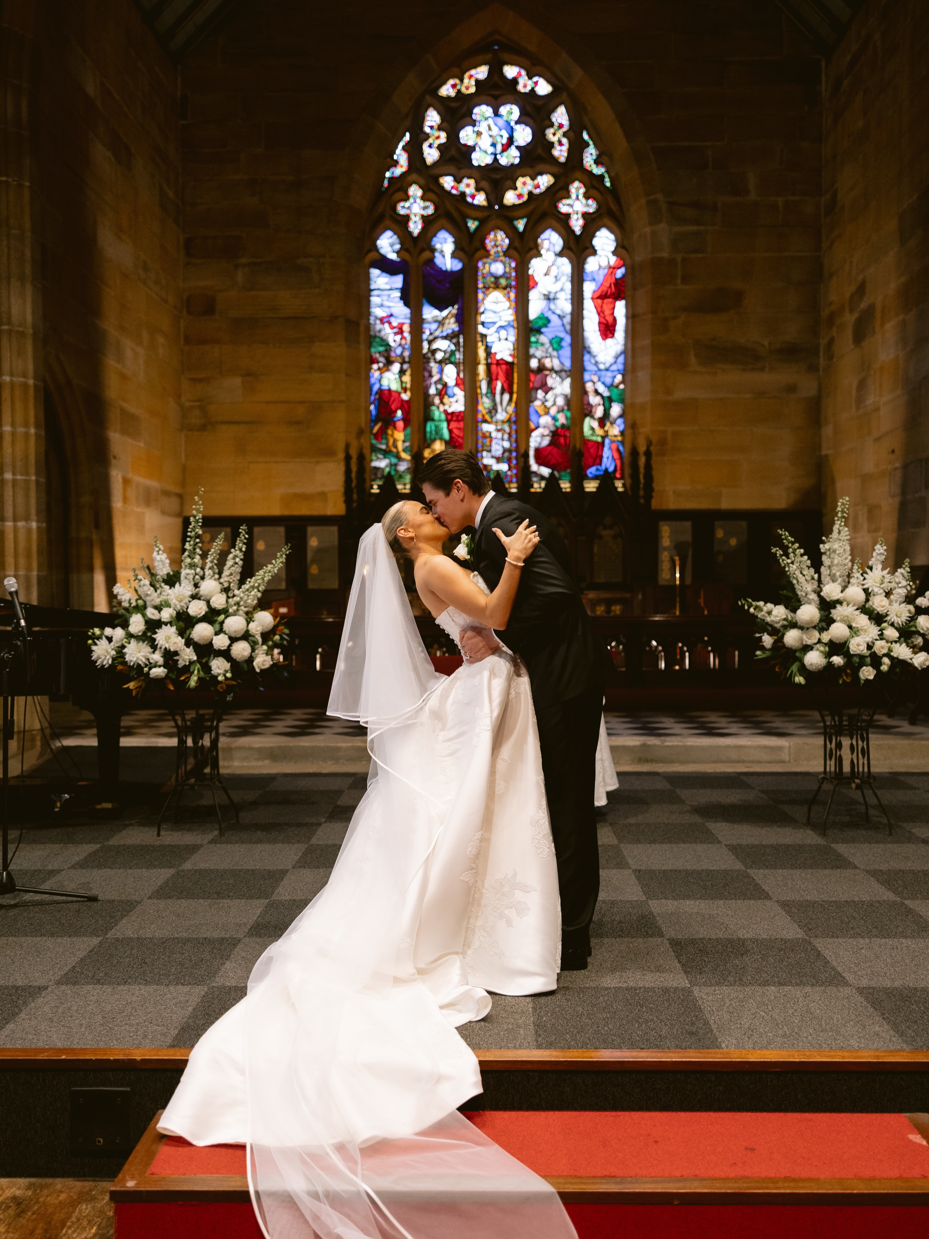 SAM + MIKAYLA
I don’t often work in Sydney, especially in the CBD, but when Mikayla reached out to do her flowers I was so keen! Mikayla is my daughter’s dance teacher, and I’ve known her mum since I was little. They’re the most lovely family
Mikayla wanted an old world, timeless elegance to tie into the beautiful ceremony at The Garrison church, followed by the breathtaking reception at the Museum of Contemporary Art. When I walked in the Foundation Hall, I gasped. Walls of green marble, epic chandeliers and overlooking Sydney harbour. It was stunning
Gorgeous pics by Jamie @luminousmoments_