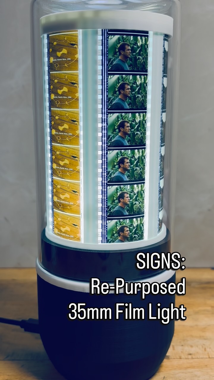 We created this unique light by re-purposing actual 35mm film from the M. Night Shyamalan movie ‘SIGNS’ released in 2002.
This custom light contains 42 actual film cells from the film and features a unique assembly (‘A World’s First’) to encapsulate this beautiful film. A small motor is inserted into the base allowing slow rotation & an internal led arrangement backlights the film. A protective glass dome is placed over the complete assembly.
We are a small family-owned business with a mission to create unique designs with the highest quality materials. All of our products are made in our studio in Ontario, Canada & shipped worldwide. #signs #mnightshyamalan