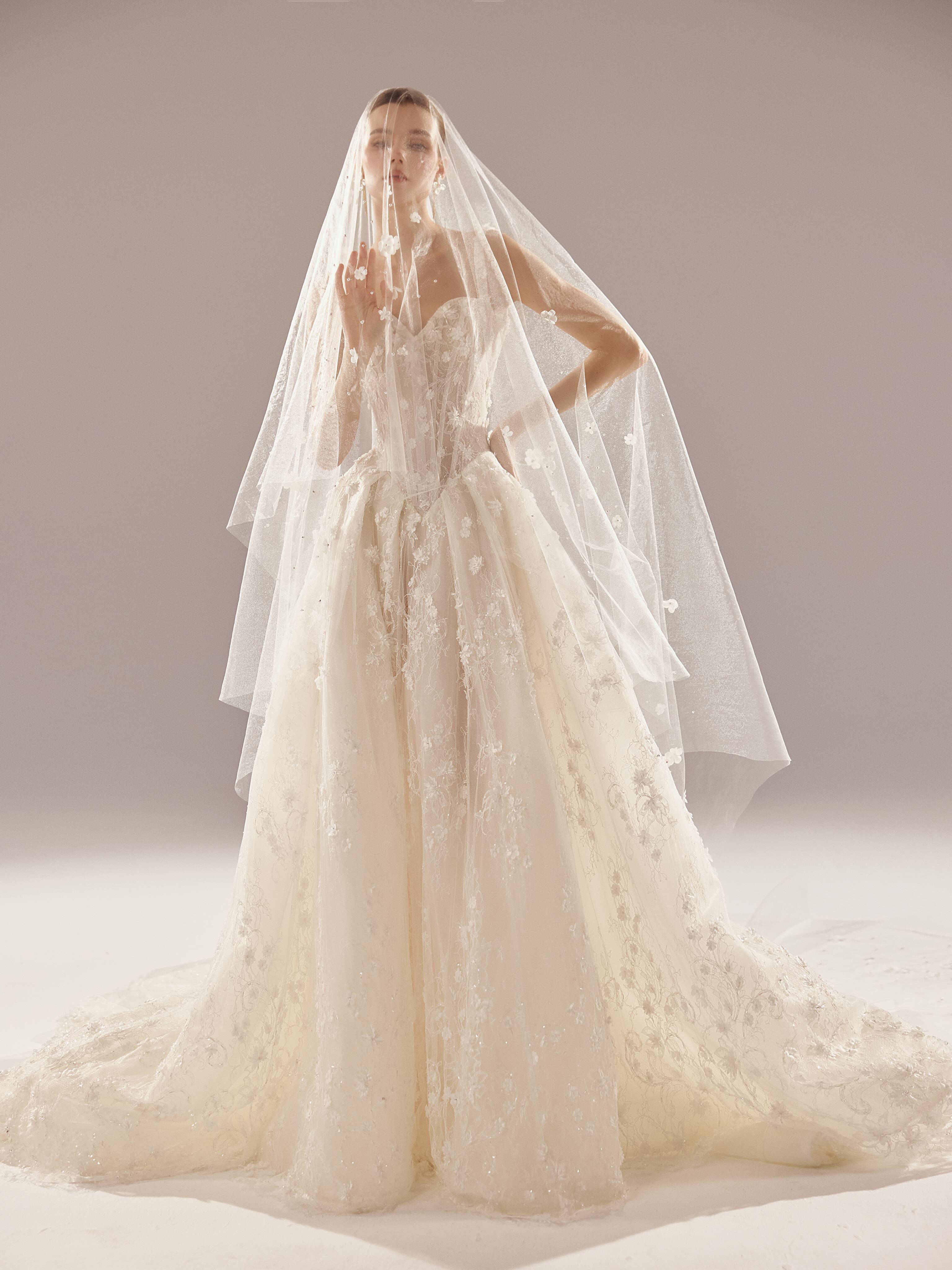 Soft romance, sculpted to perfection.
A dreamy 3D floral ball gown featuring a structured drop-waist corset, delicate lace appliqués, subtle sparkle, and a romantic full skirt. Finished with a low open back for the perfect balance of modern and timeless.
And with the matching floral veil? Absolutely unforgettable. 🌸
#weddingdress #floralweddingdress #2027bride #orangecountywedding #cherieamorbridal