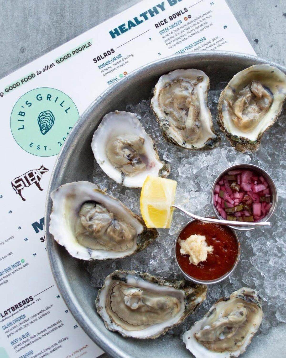 Freshly shucked, perfectly served 🦪 #freshoysters #shuckyeah #oystersonthehalfshell #libsgrill