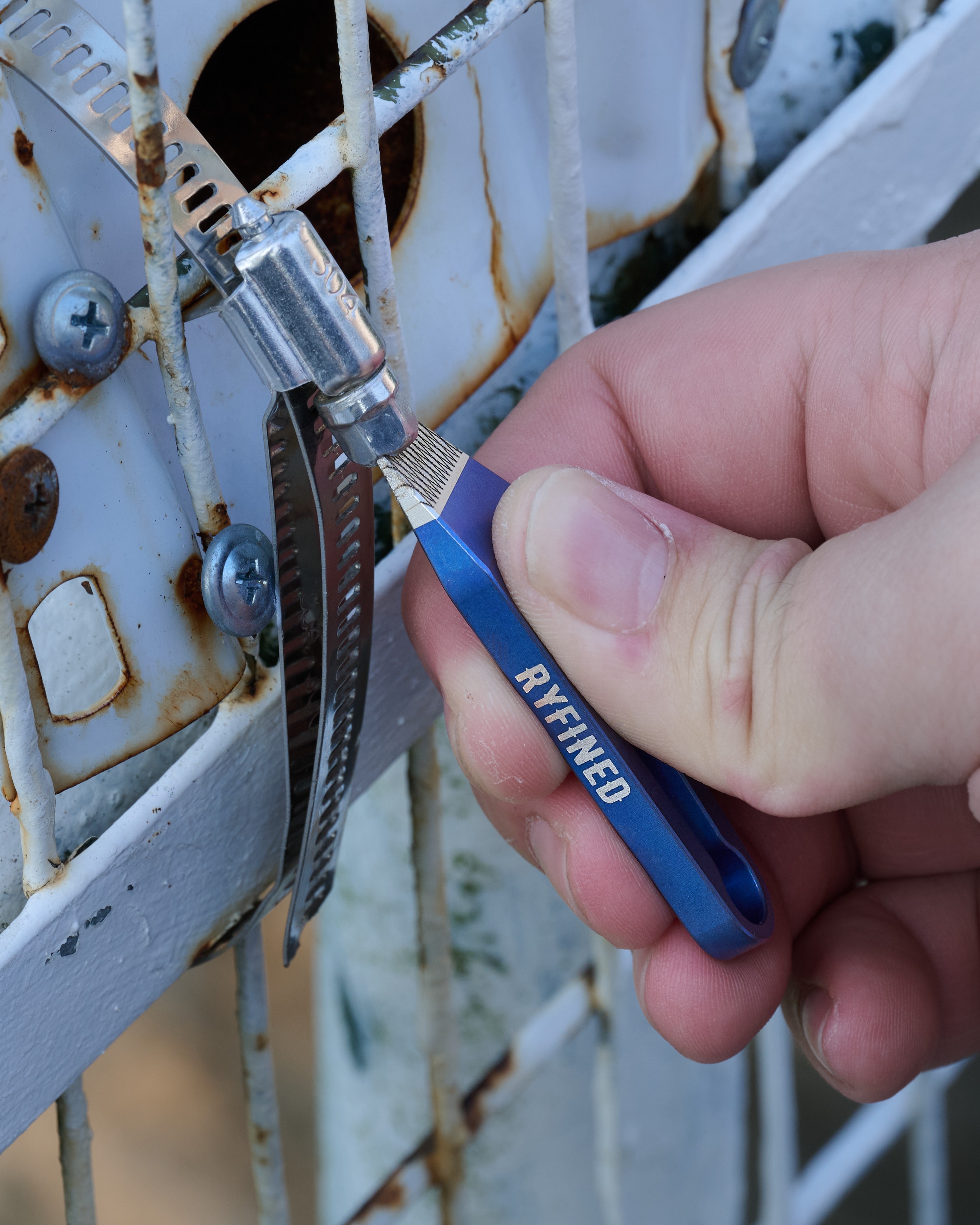 The Jiminy Titanium Pry Bar in striking stonewashed blue - with our laser-etched, carbidized Grip Tip for maximum wear resistance and zero slip when you need to bite into a tough job.
